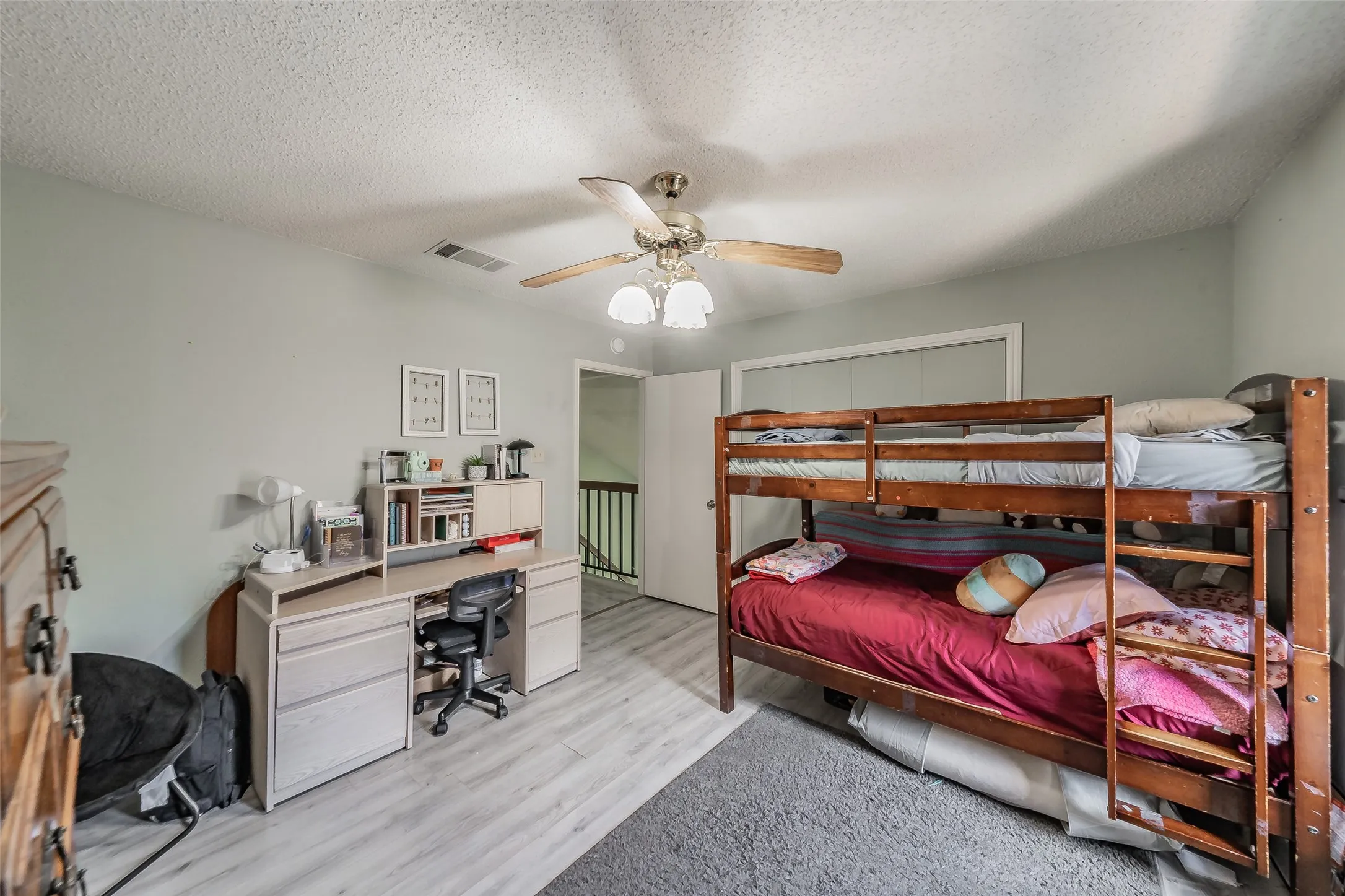 Light-toned wood-finish flooring throughout