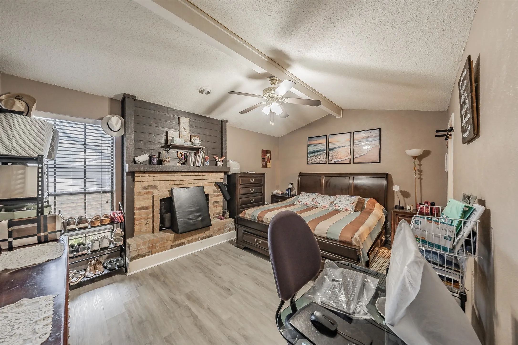 Vaulted ceiling with exposed beam and ceiling fan