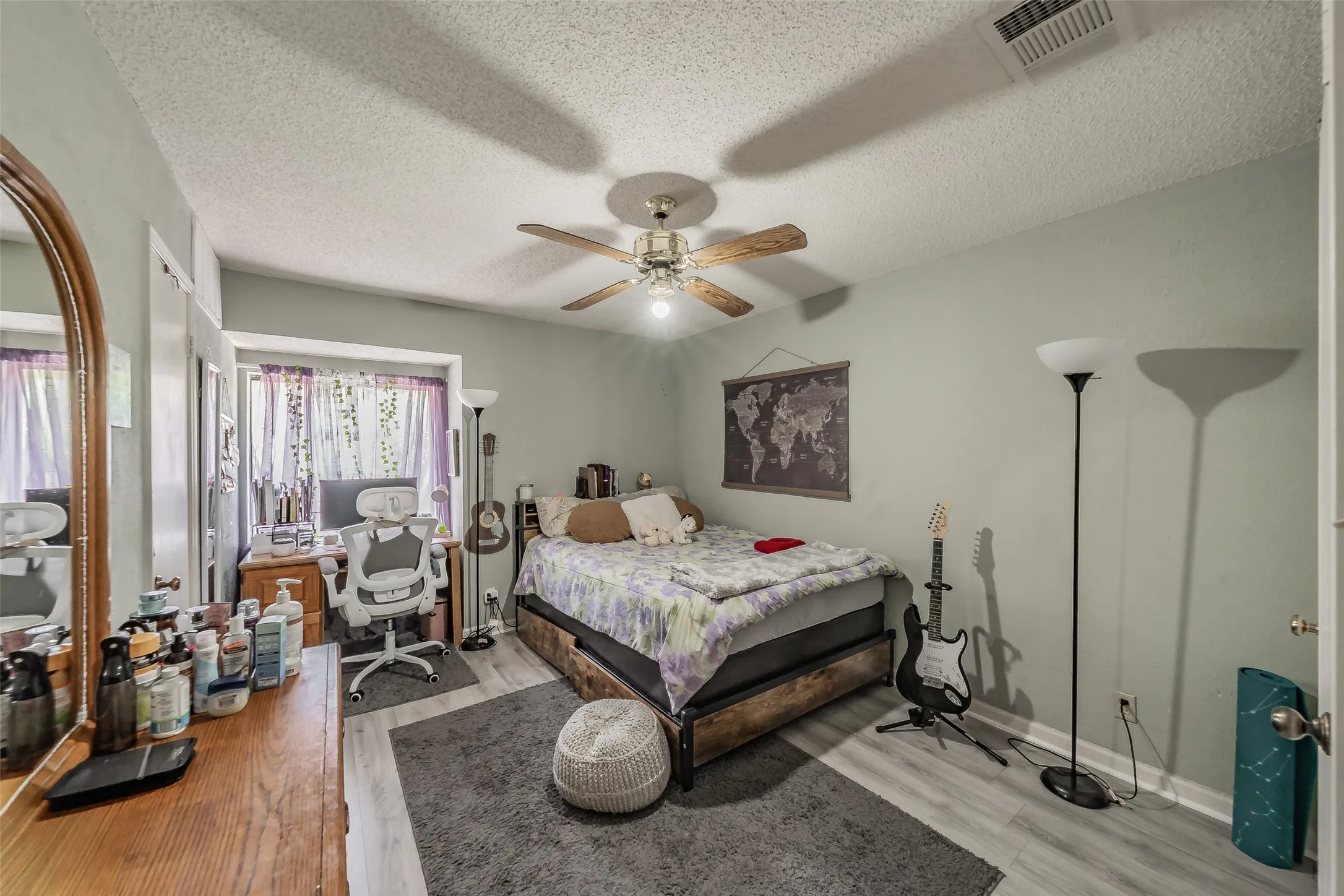 Light-toned plank flooring throughout