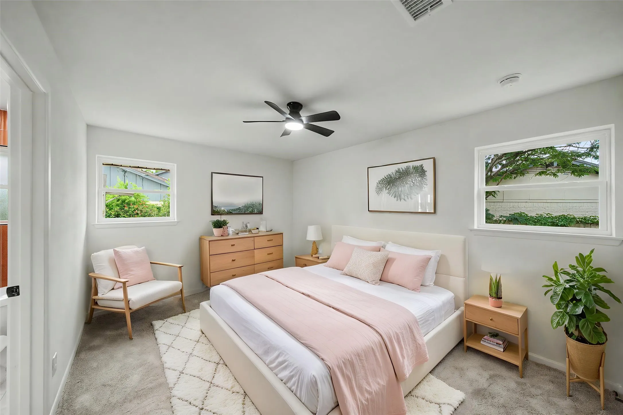 Soft gray wall finish paired with light gray carpet flooring