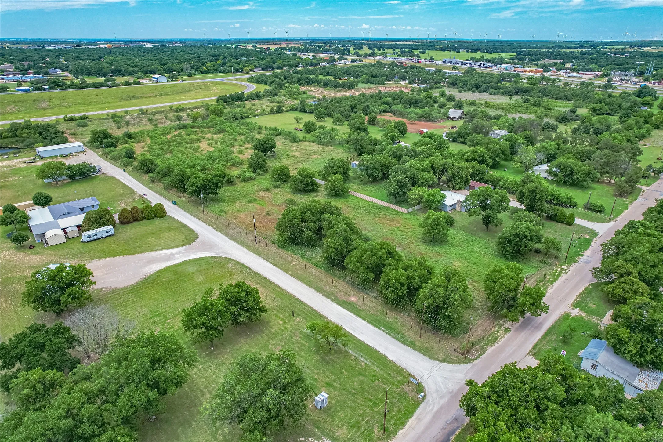 Expansive acreage featuring mature trees and open green spaces