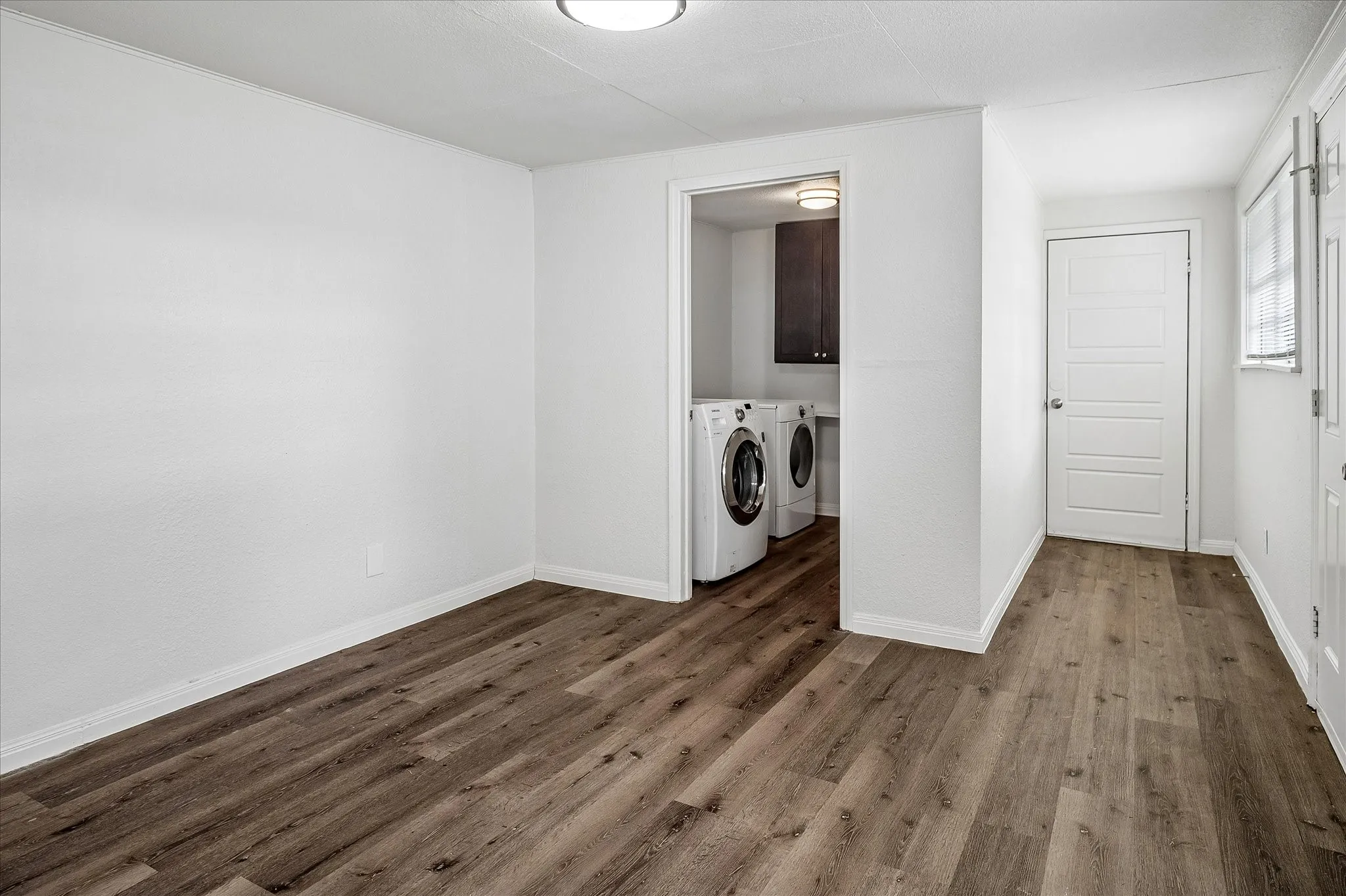Bonus room and utility room with hall to the 2 car garage