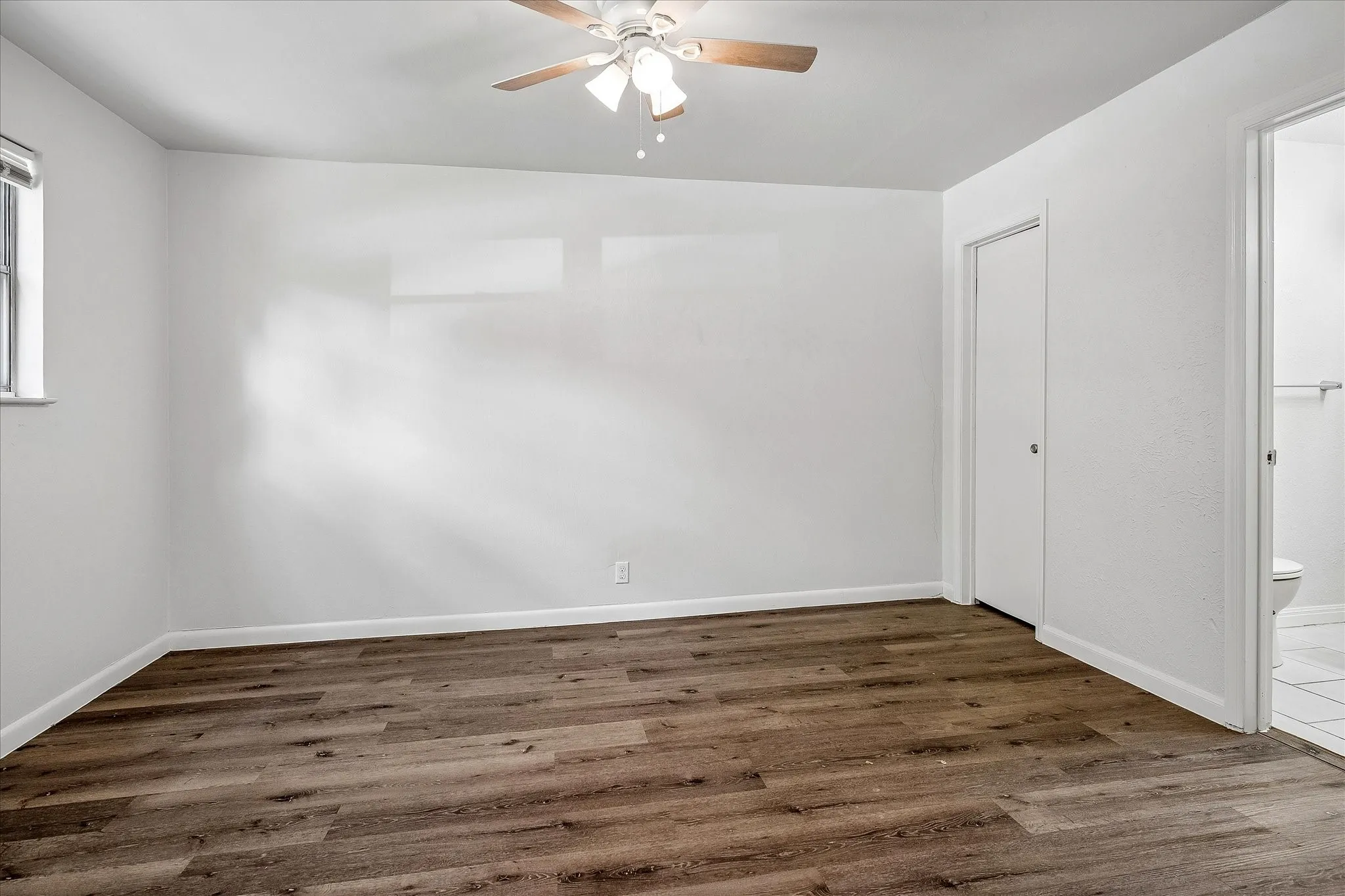 Front bedroom with a walk in closet and private bathroom.