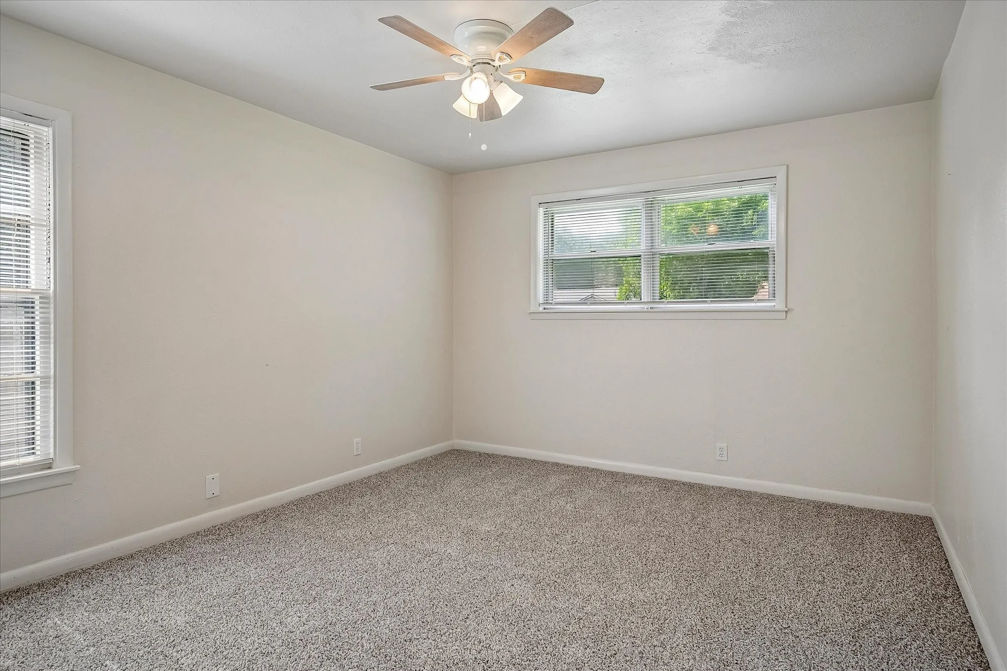 Secondary bedroom 3 with fresh carpet installed in May of 2026.