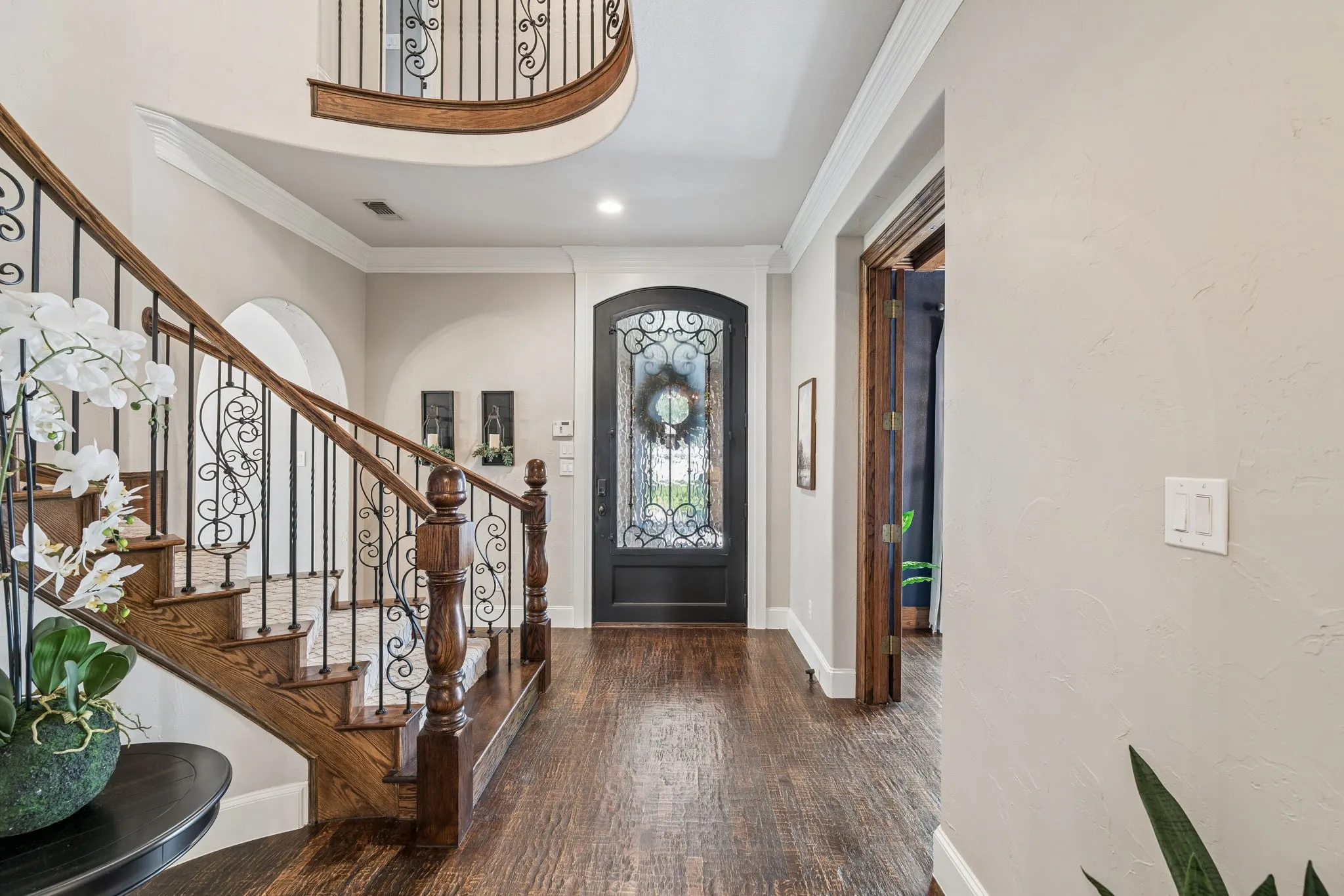Beautiful hardwood flooring and a dramatic staircase greets you as you enter this magnificent home.
