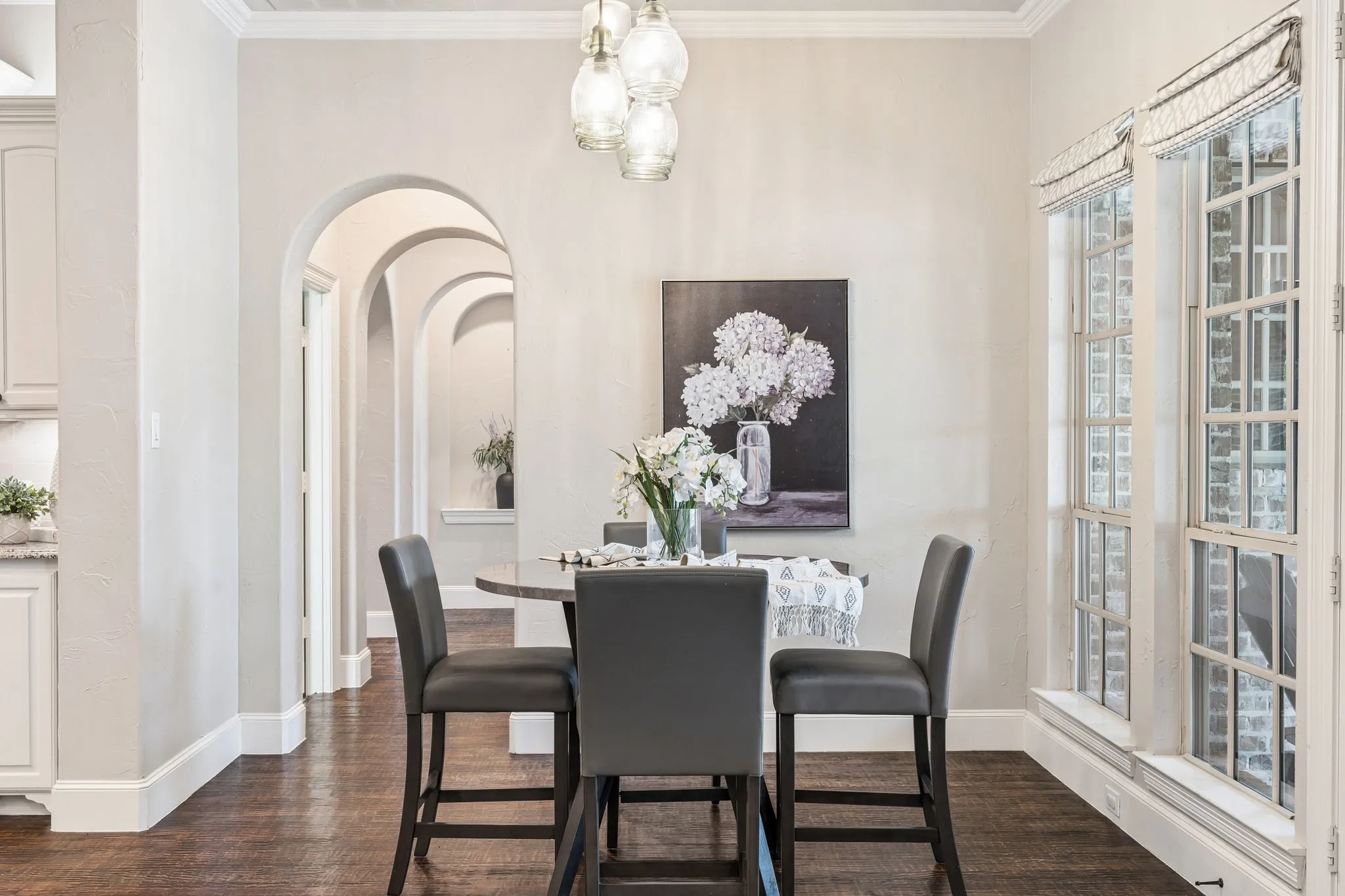 Imagine breakfasts here in the nook. The windows afford incredible views of the pool and outdoor living area as soft morning sunshine streams in.