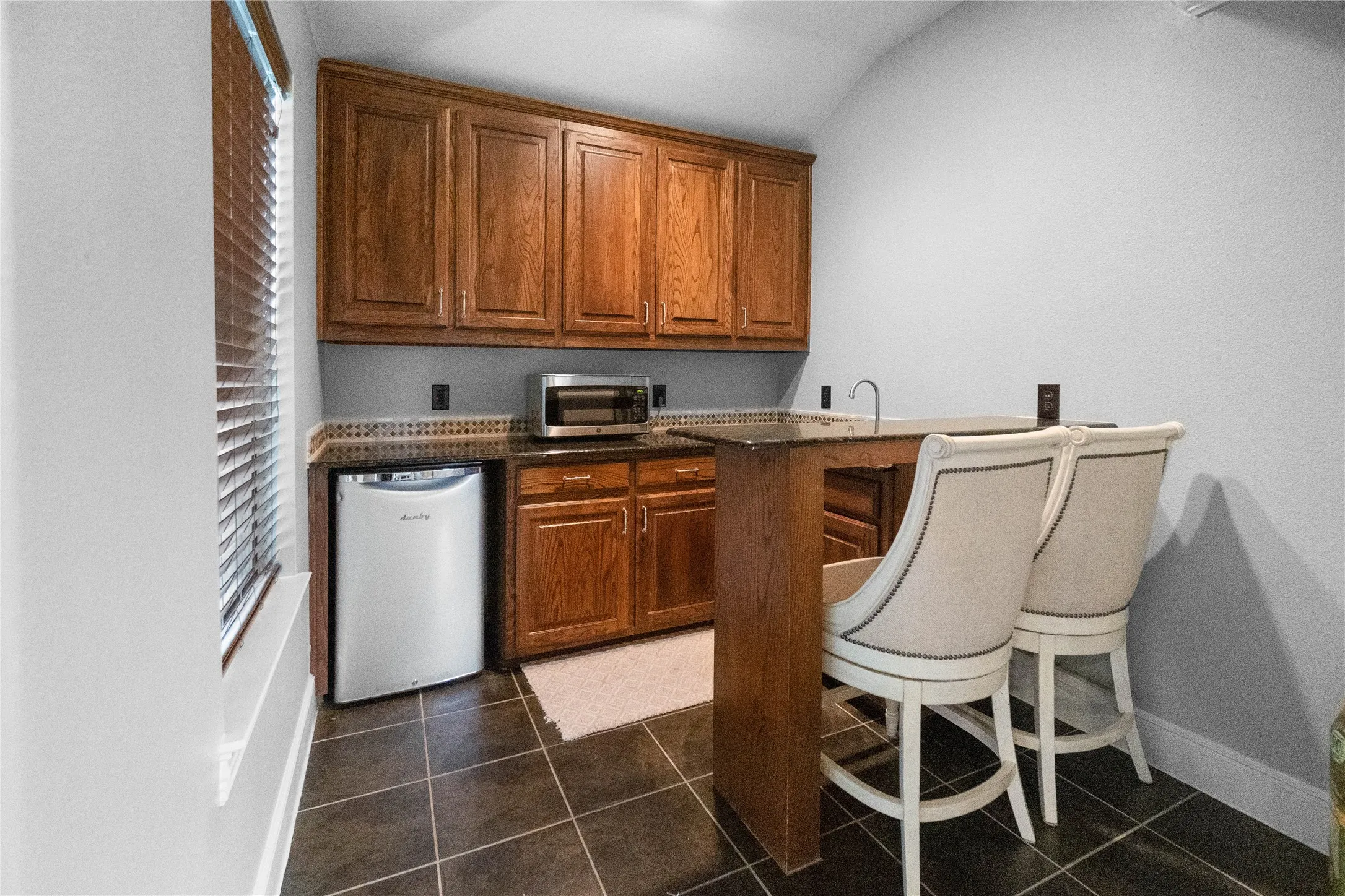 Bar between media and game room
