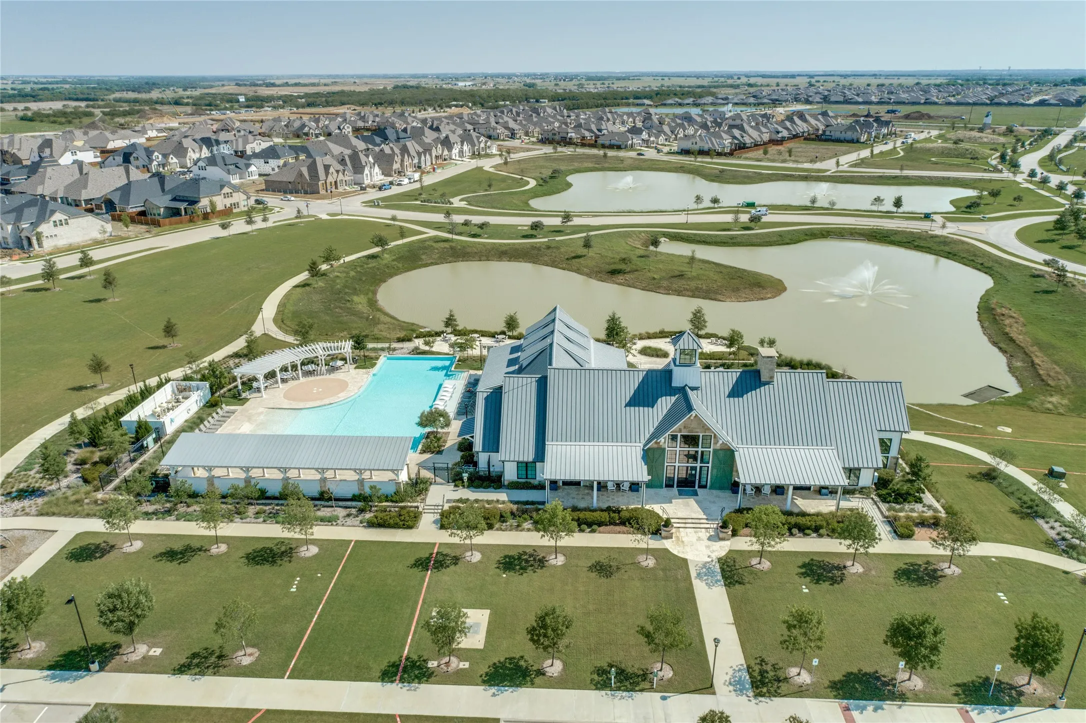 Experience the award-winning lifestyle that makes Sandbrock Ranch one of North Texas' premier master-planned communities. Residents enjoy access to an impressive amenity center featuring a resort-style pool, splash areas, playgrounds, open green spaces, walking trails, fitness opportunities, and year-round community events. Designed to bring neighbors together, these exceptional amenities provide endless opportunities for recreation, relaxation, and outdoor enjoyment.