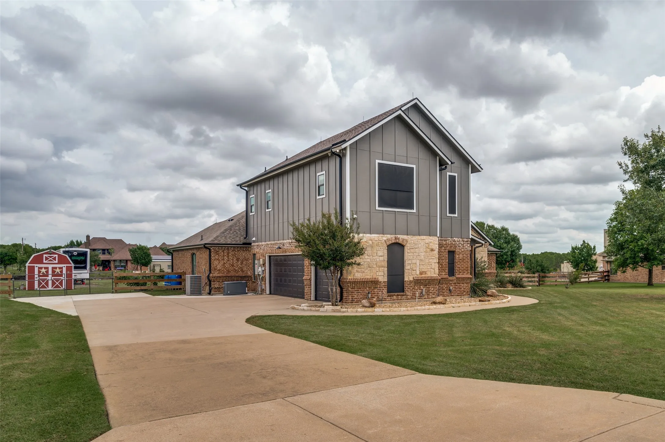 Stunning custom home on a spacious homesite with beautiful curb appeal, and a serene setting. Enjoy the perfect combination of style, comfort, and country living. Notice the 3 car garage, backyard storage building, and two HVAC units.