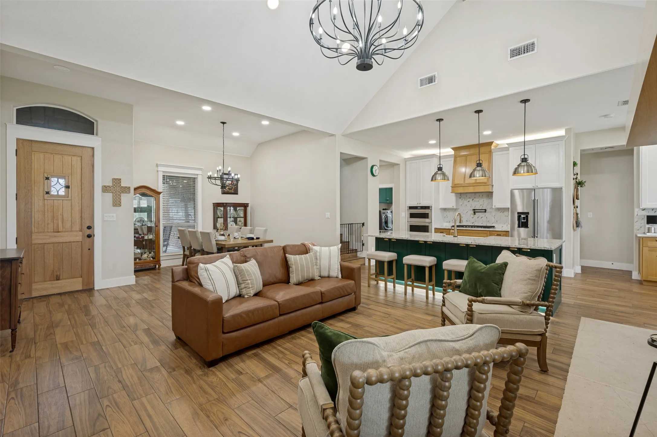 The expansive layout offers plenty of room for gatherings, while the warm finishes and abundant natural light make every occasion feel inviting and comfortable.