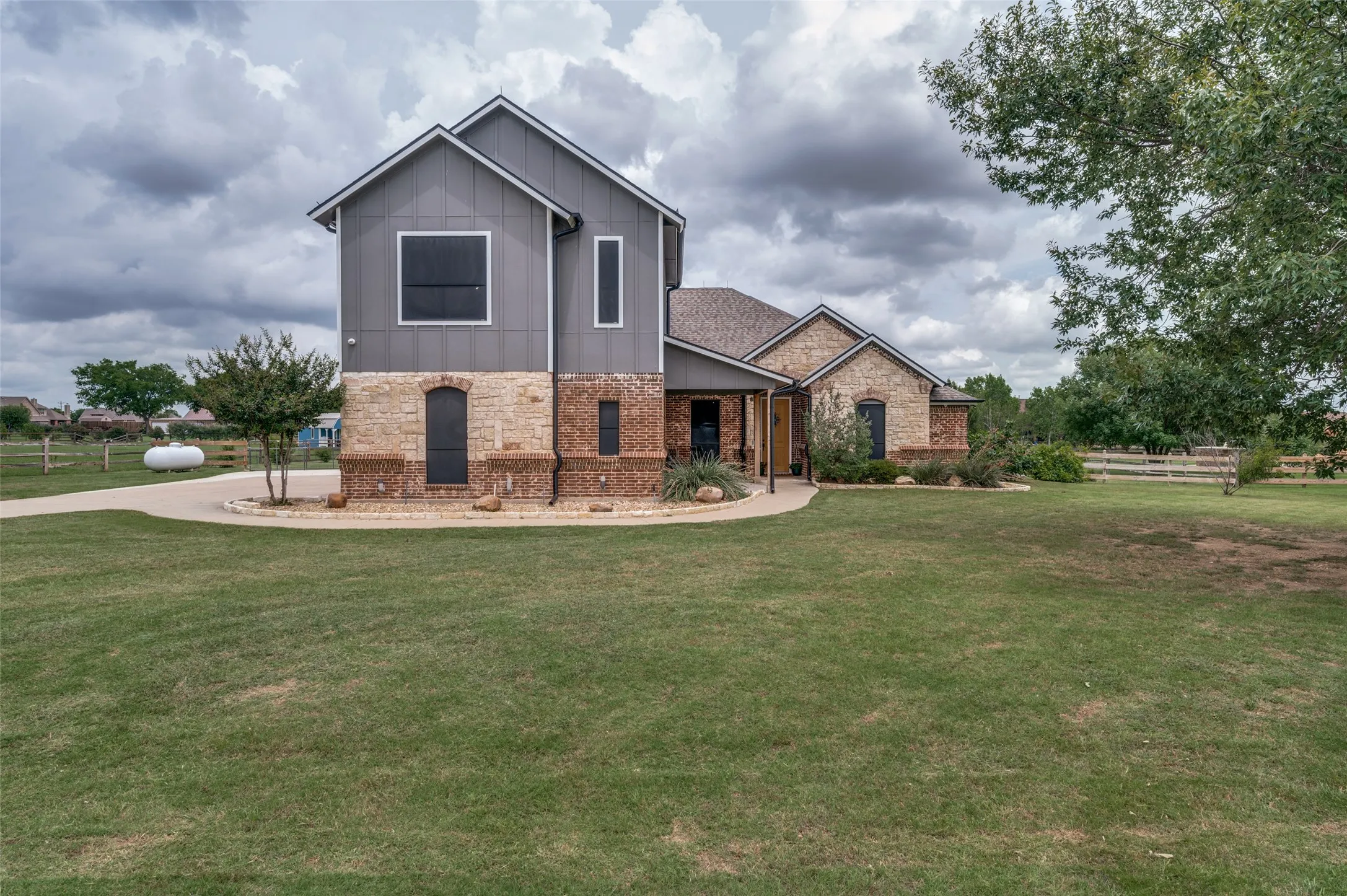 Beautifully designed custom home featuring a striking blend of stone, brick, and modern finishes. Nestled on a spacious lot, this property offers peaceful living, exceptional curb appeal, and room to enjoy the outdoors. Notice the beautiful brick and stone, established landscaping, and solar screens.