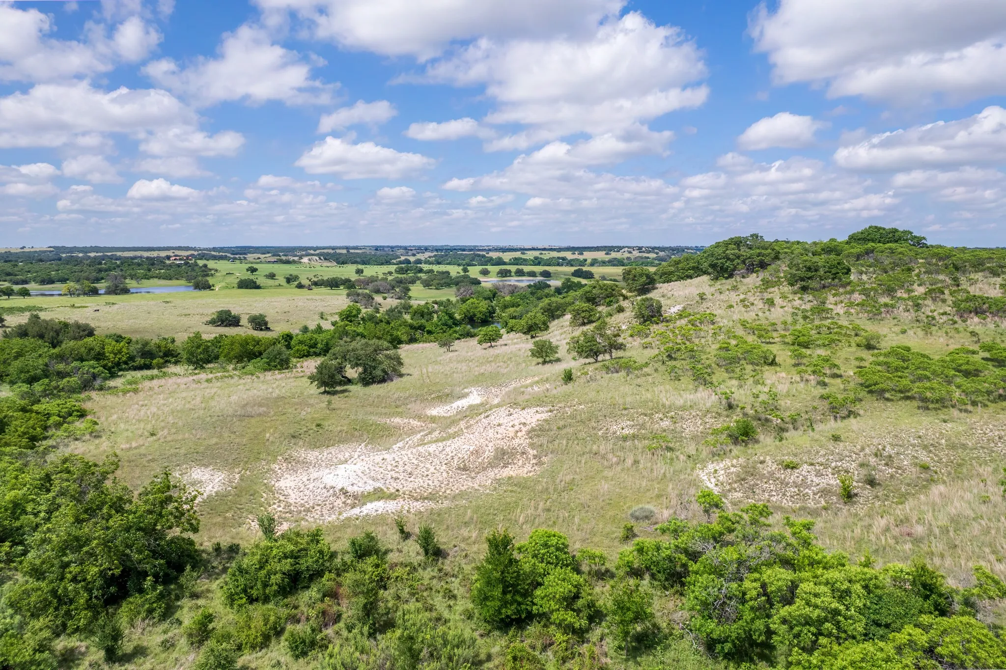 Expansive land parcel featuring rolling hills and varied topography