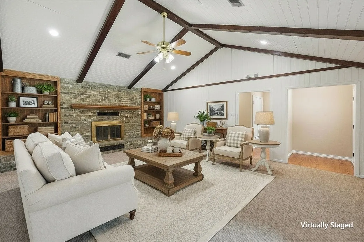 Virtually staged living room highlighting the home's impressive gathering space and fireplace.