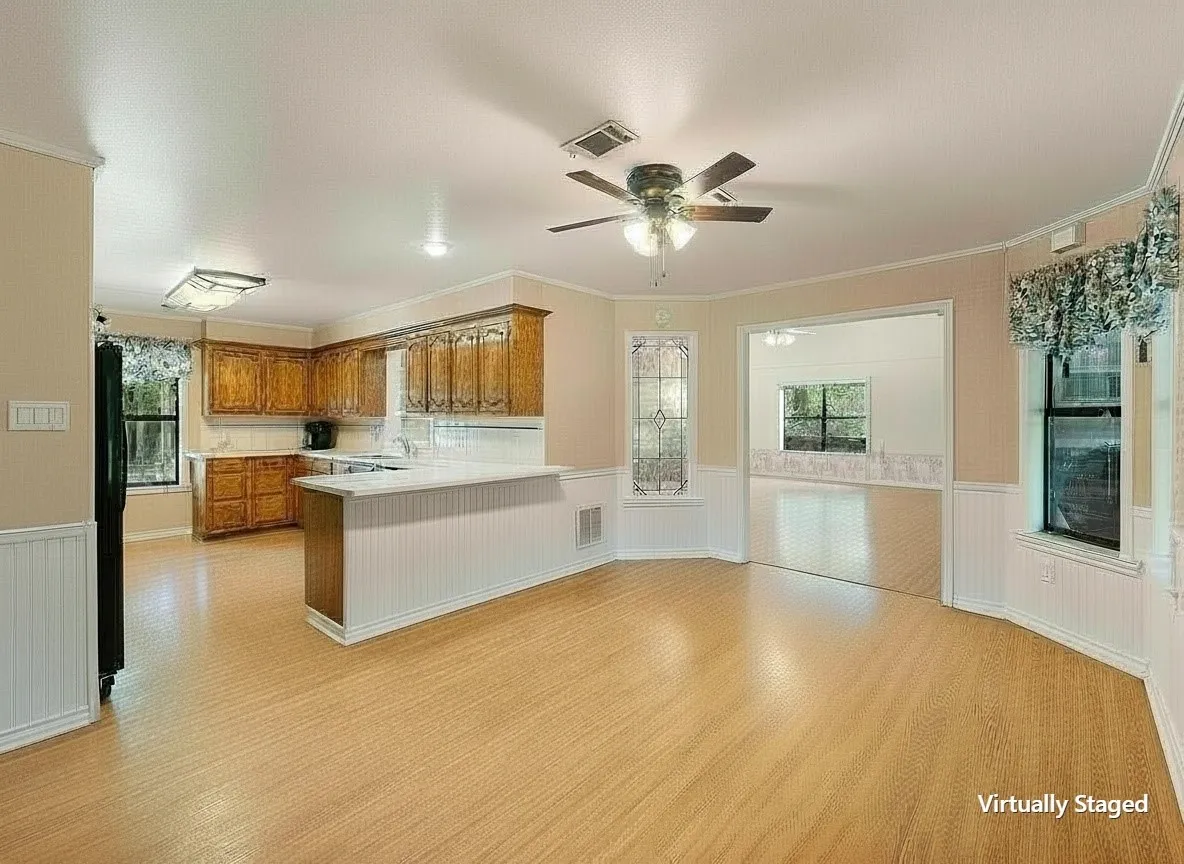 Virtually staged open-concept kitchen flowing seamlessly into the living areas.