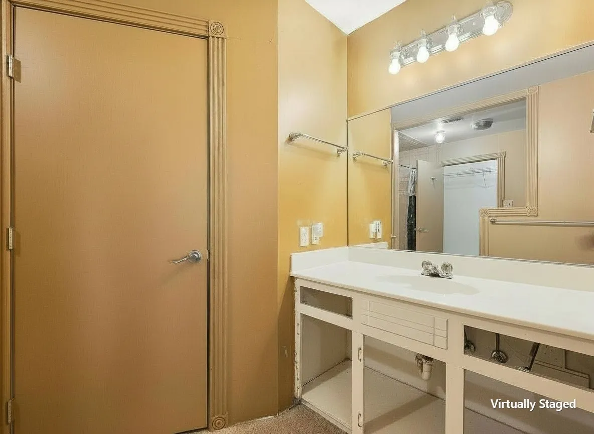 Virtually staged primary vanity highlighting abundant storage and counter space.