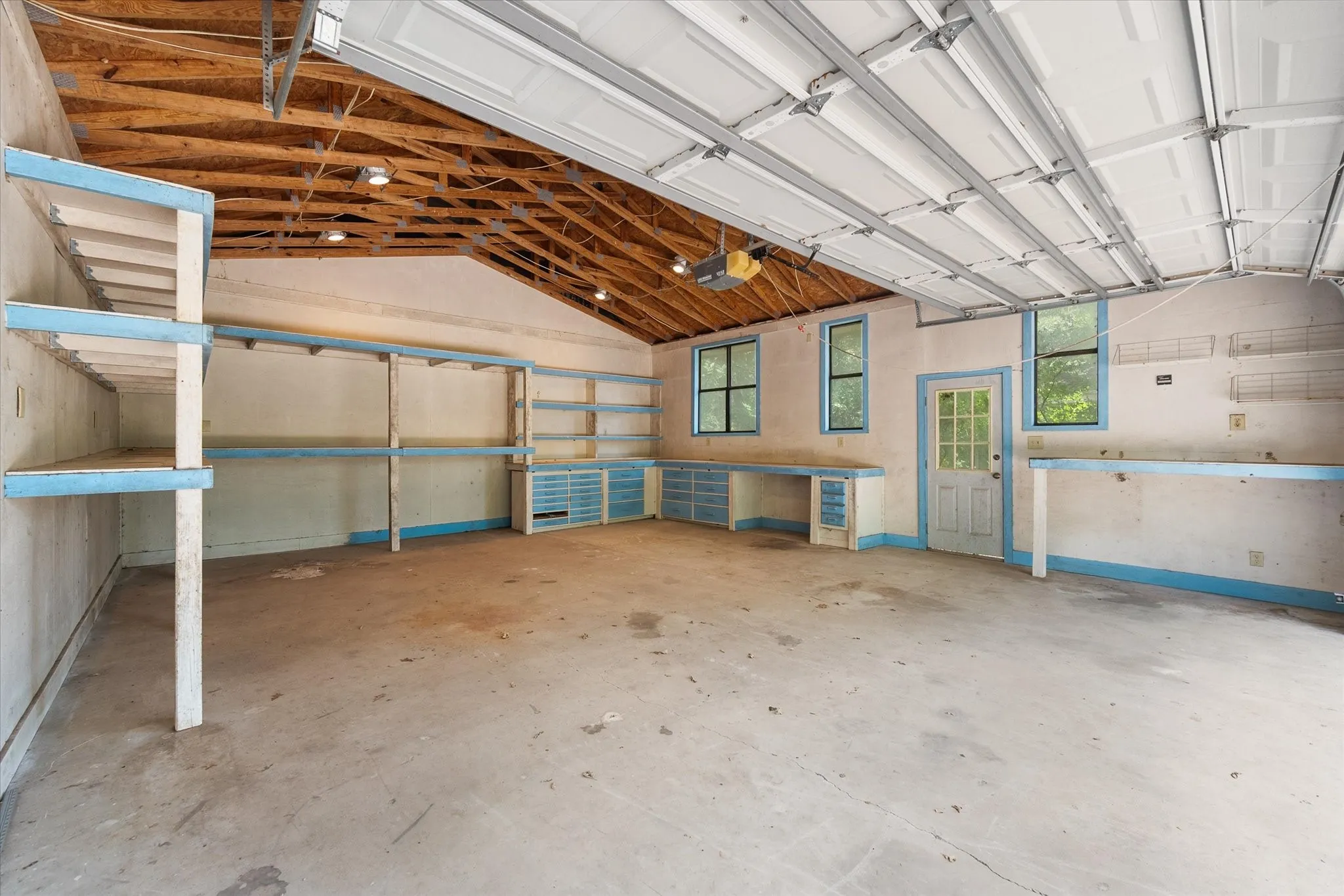 Garage storage space adds parking, organization, and functionality to this Corsicana acreage home.