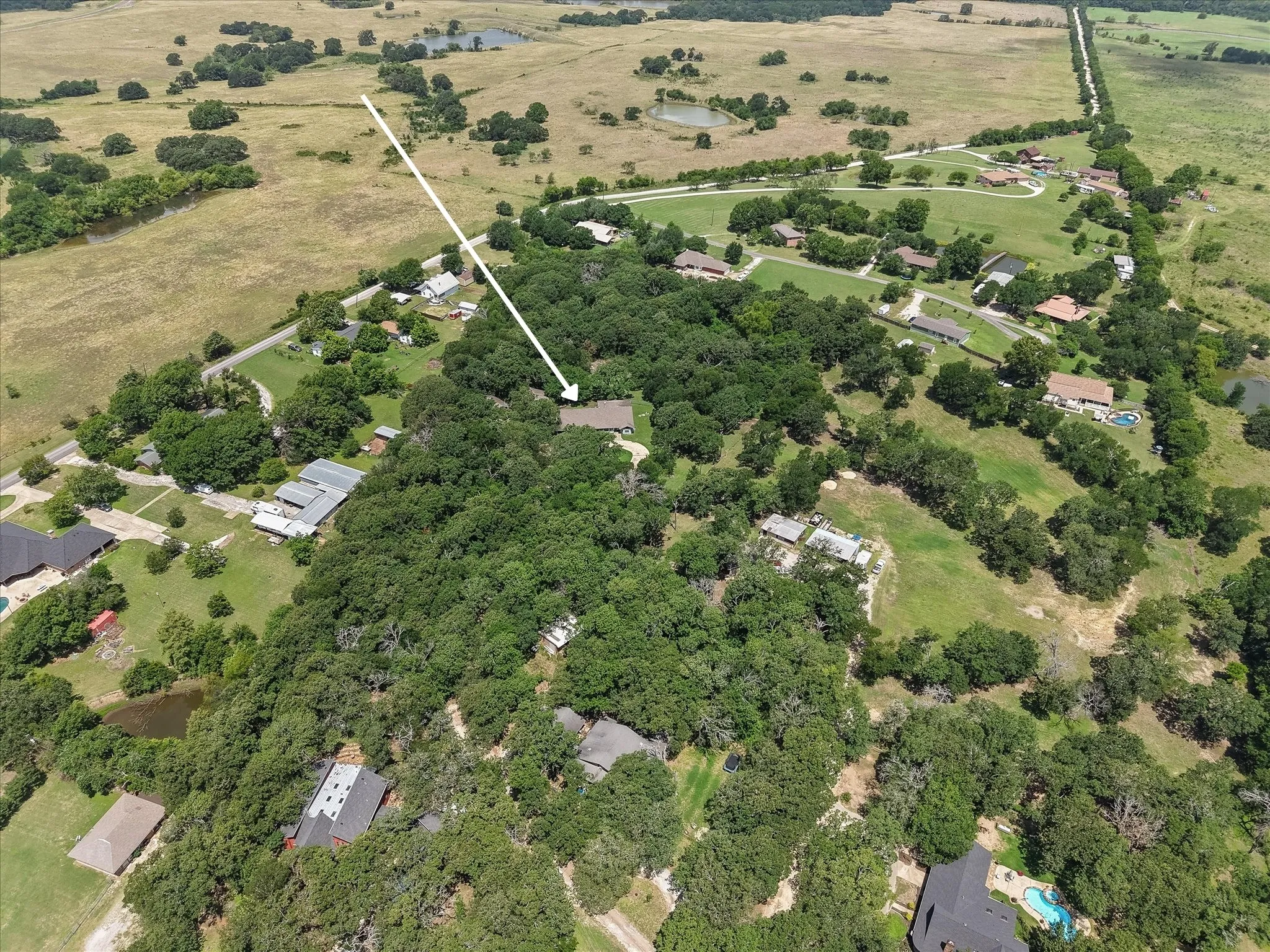 Bird's-eye view showcasing the peaceful setting and surrounding countryside.