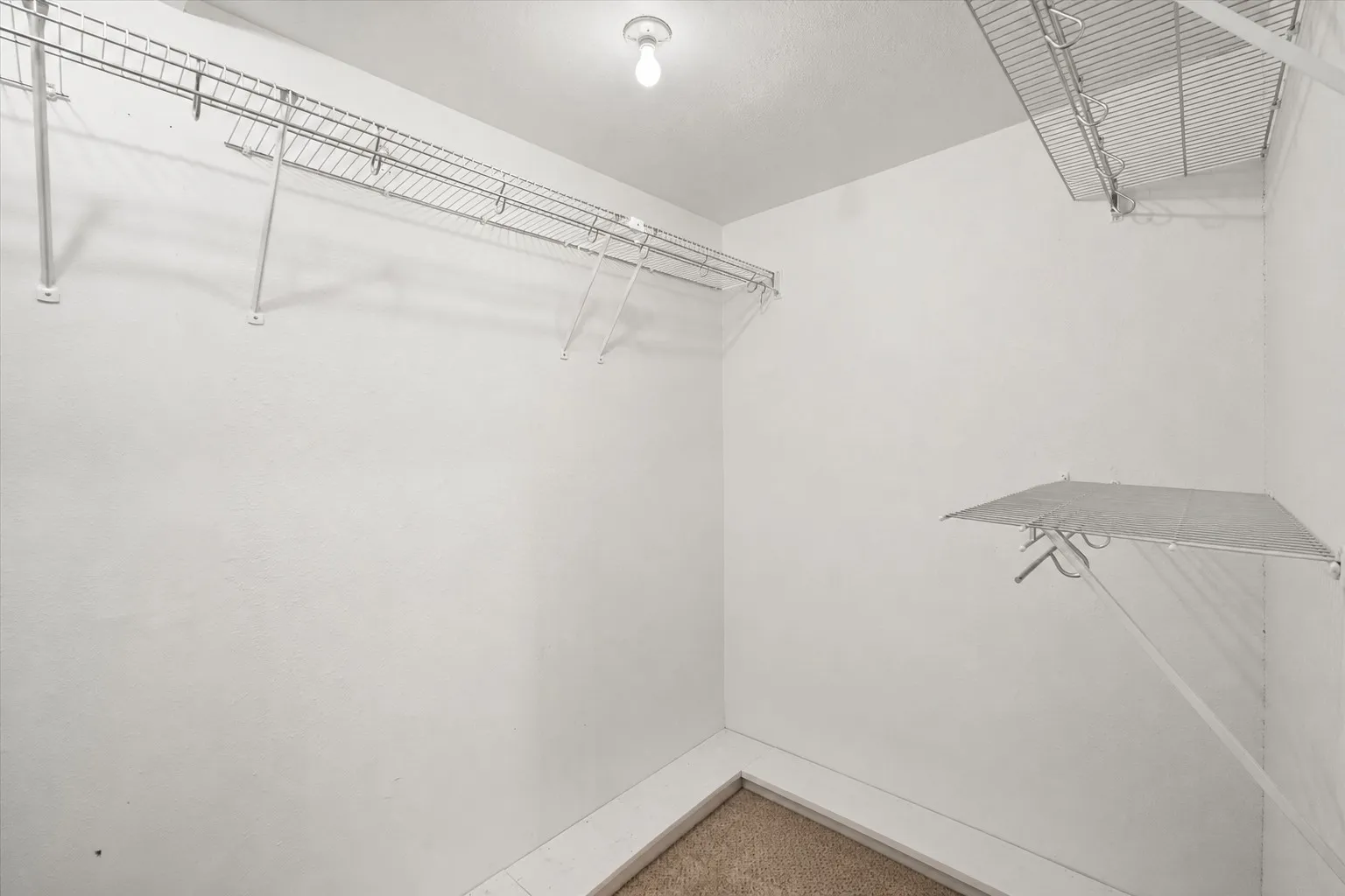 Walk-in closet storage adds practical space to this 3-bedroom country home near Dallas.