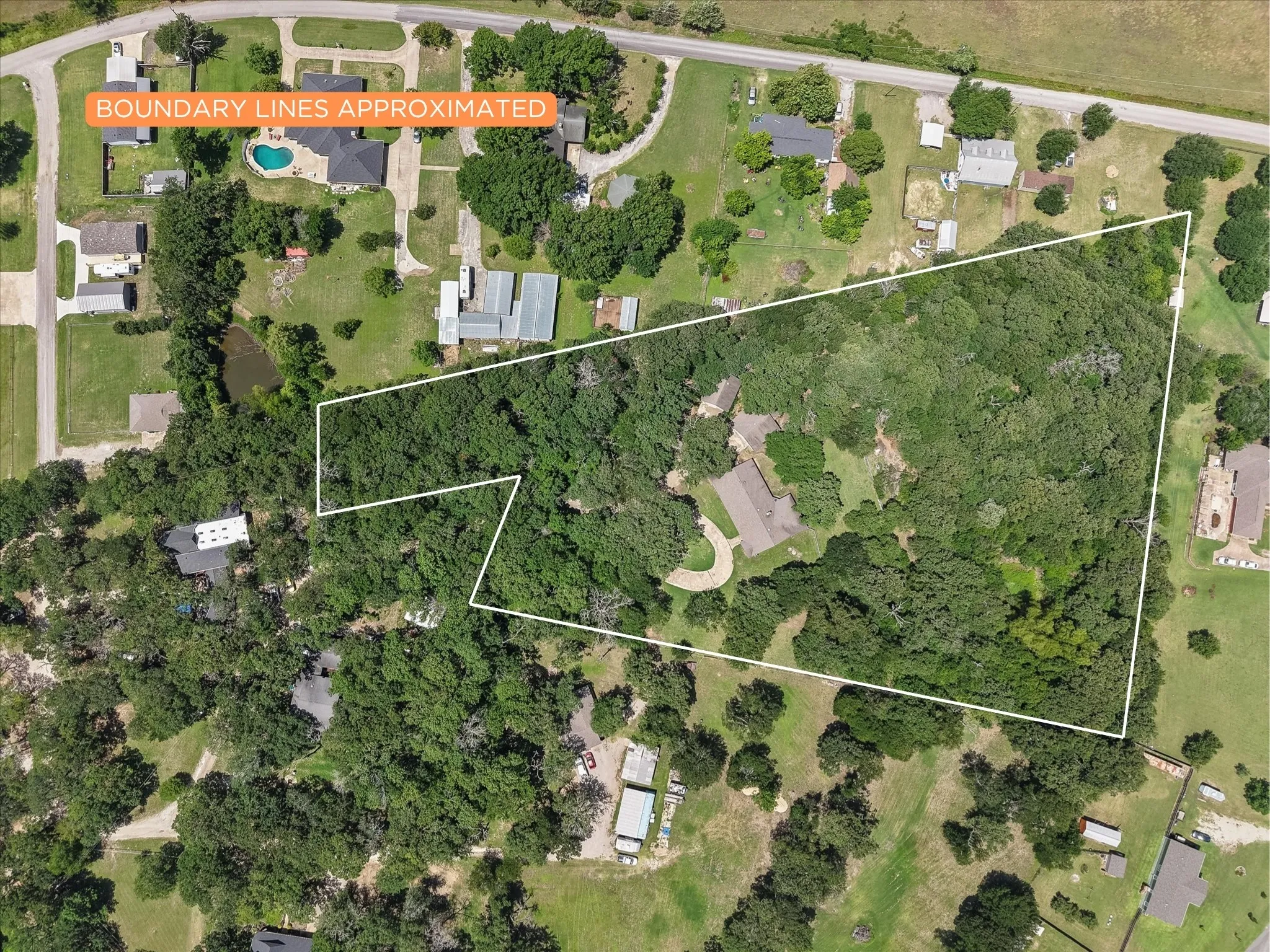 Aerial view showing the approximate property boundaries across 5.07 beautiful acres.