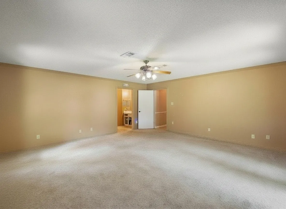 Expansive primary bedroom offering endless layout possibilities.