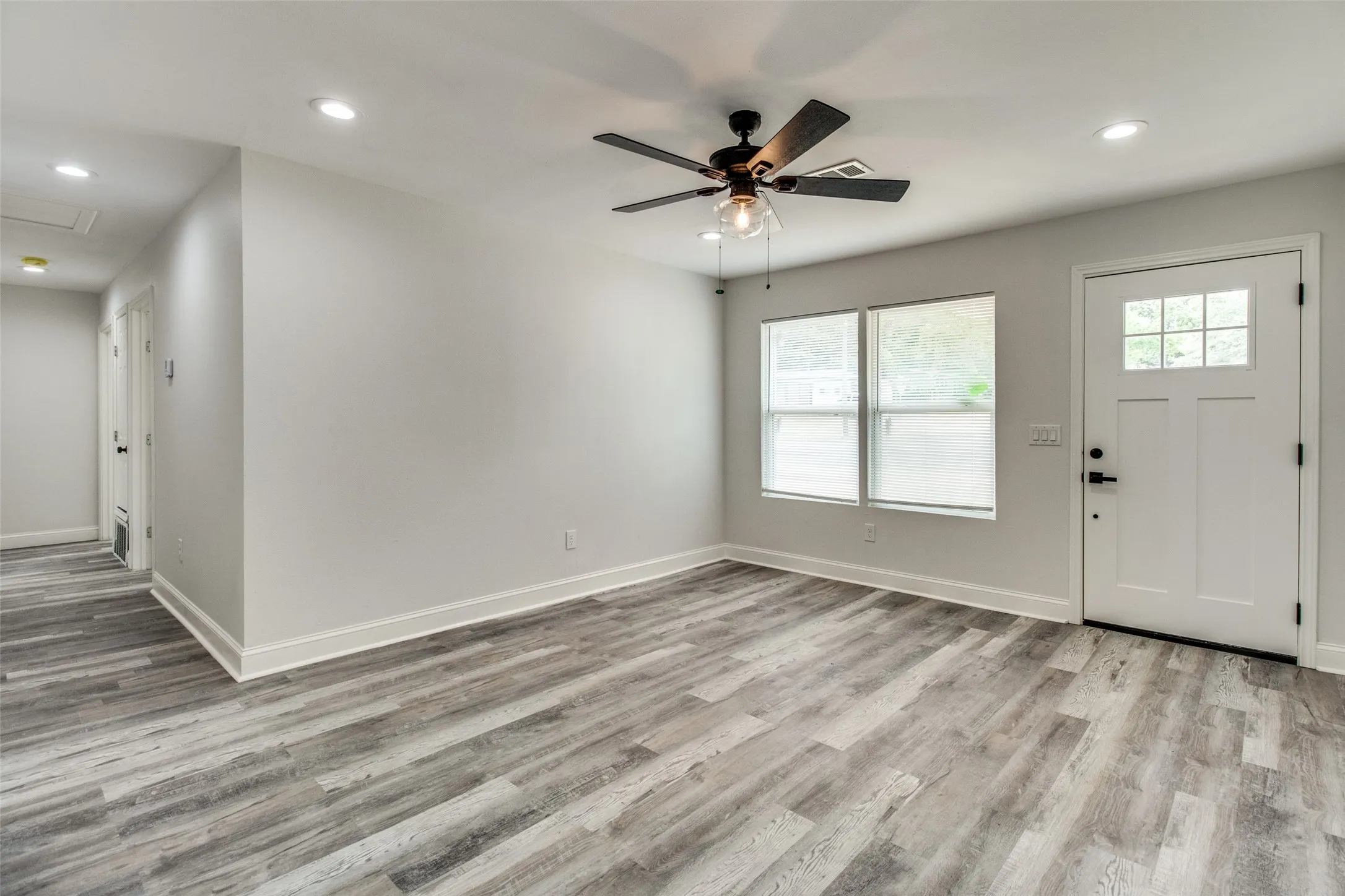 Foyer featuring light hardwood / wood-style floors and ceiling fan