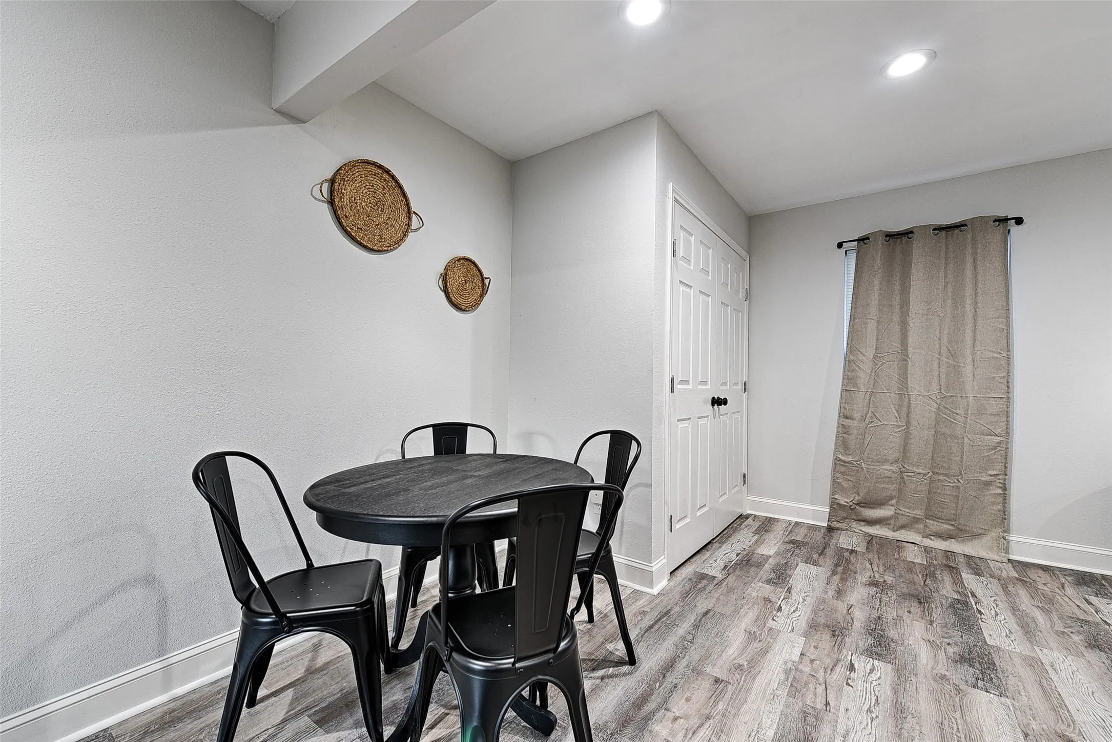 Dining room with light hardwood / wood-style floors