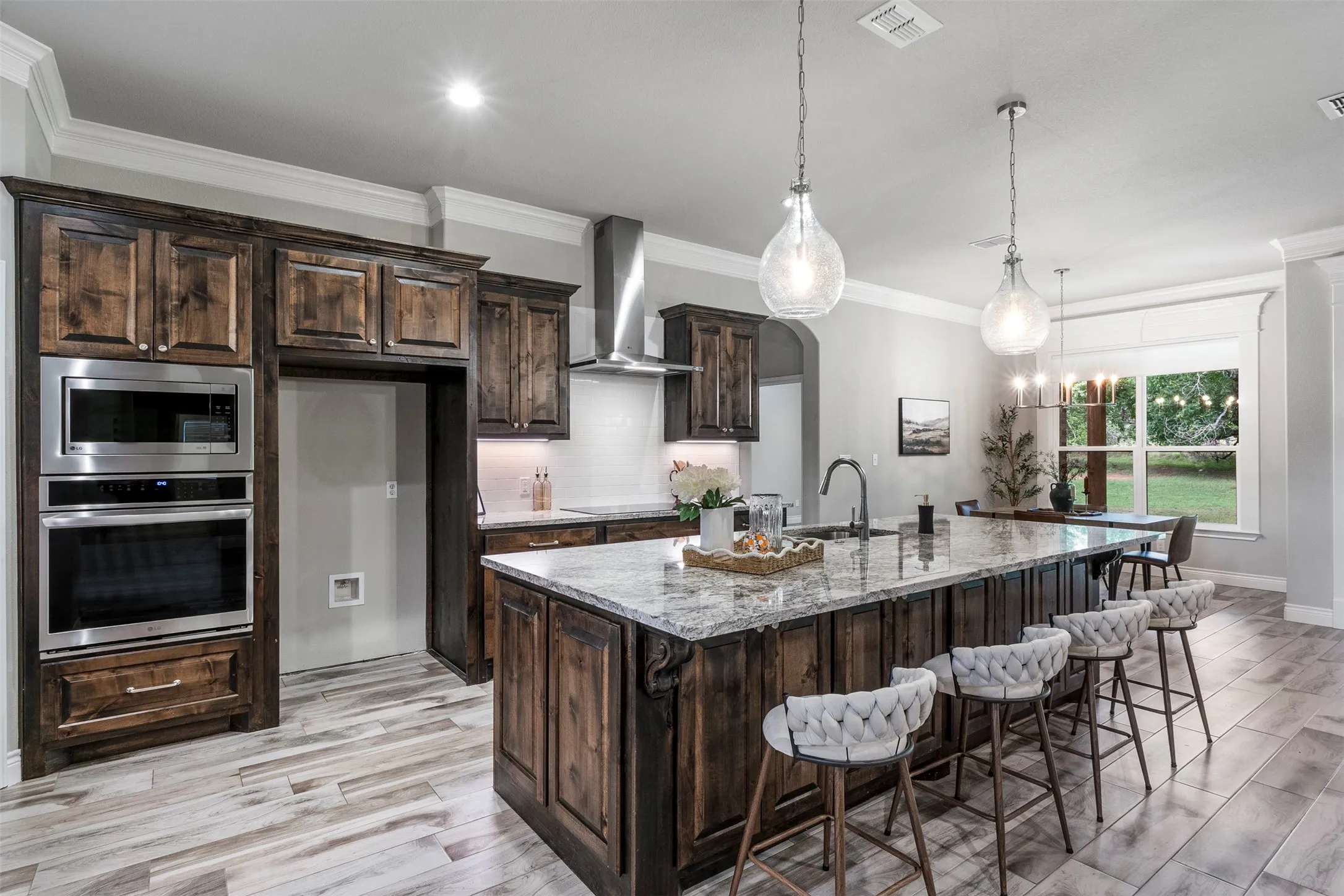 No carpet anywhere in the home—durable wood-look tile flooring runs throughout all living areas and bedrooms.