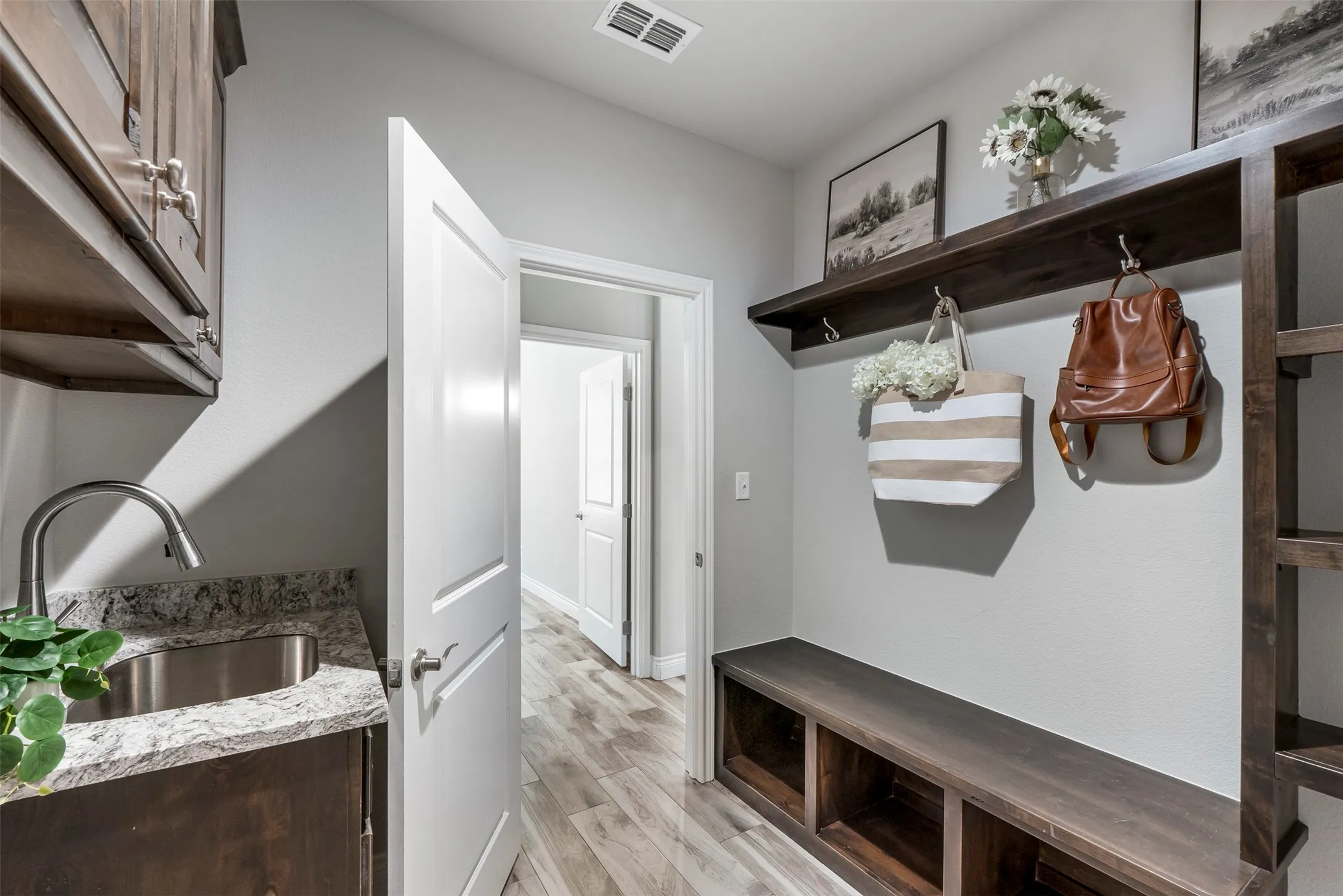 Custom mudroom with built-in cabinetry and dedicated storage.