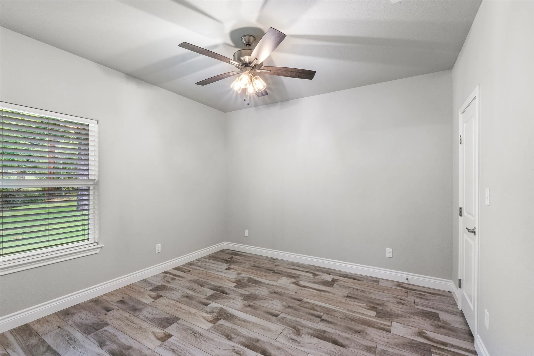 Spacious secondary bedroom with closet storage and flexibility for guests, family or home office.