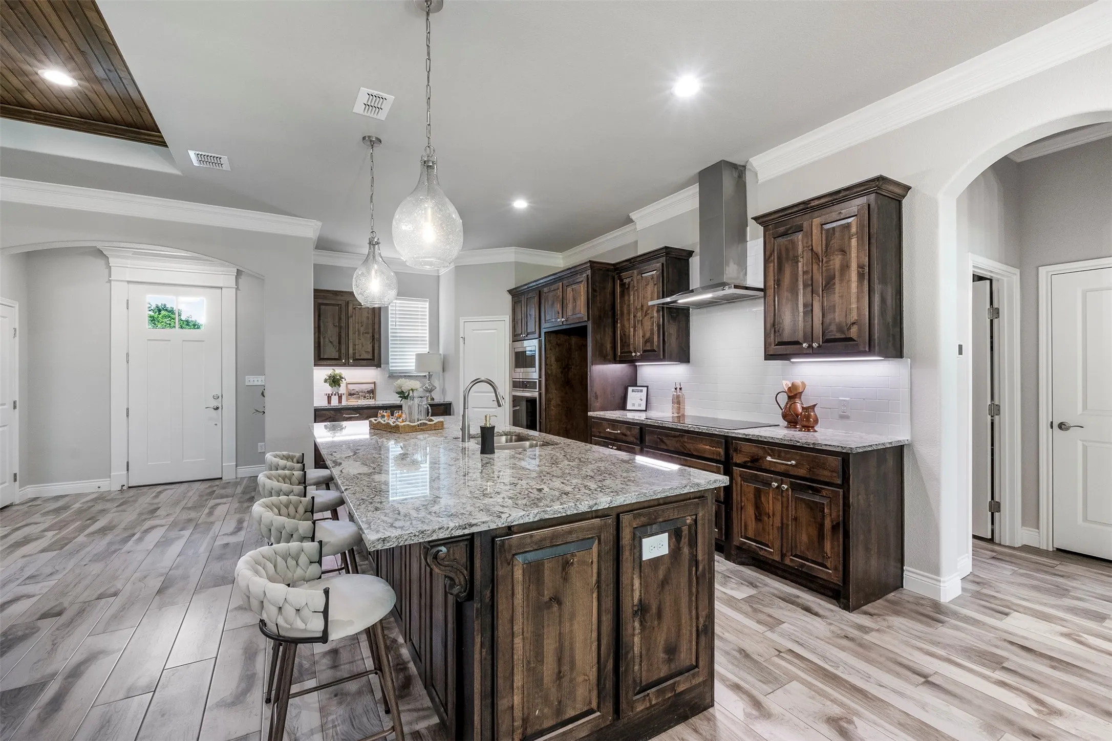 No carpet anywhere in the home—durable wood-look tile flooring runs throughout all living areas and bedrooms.