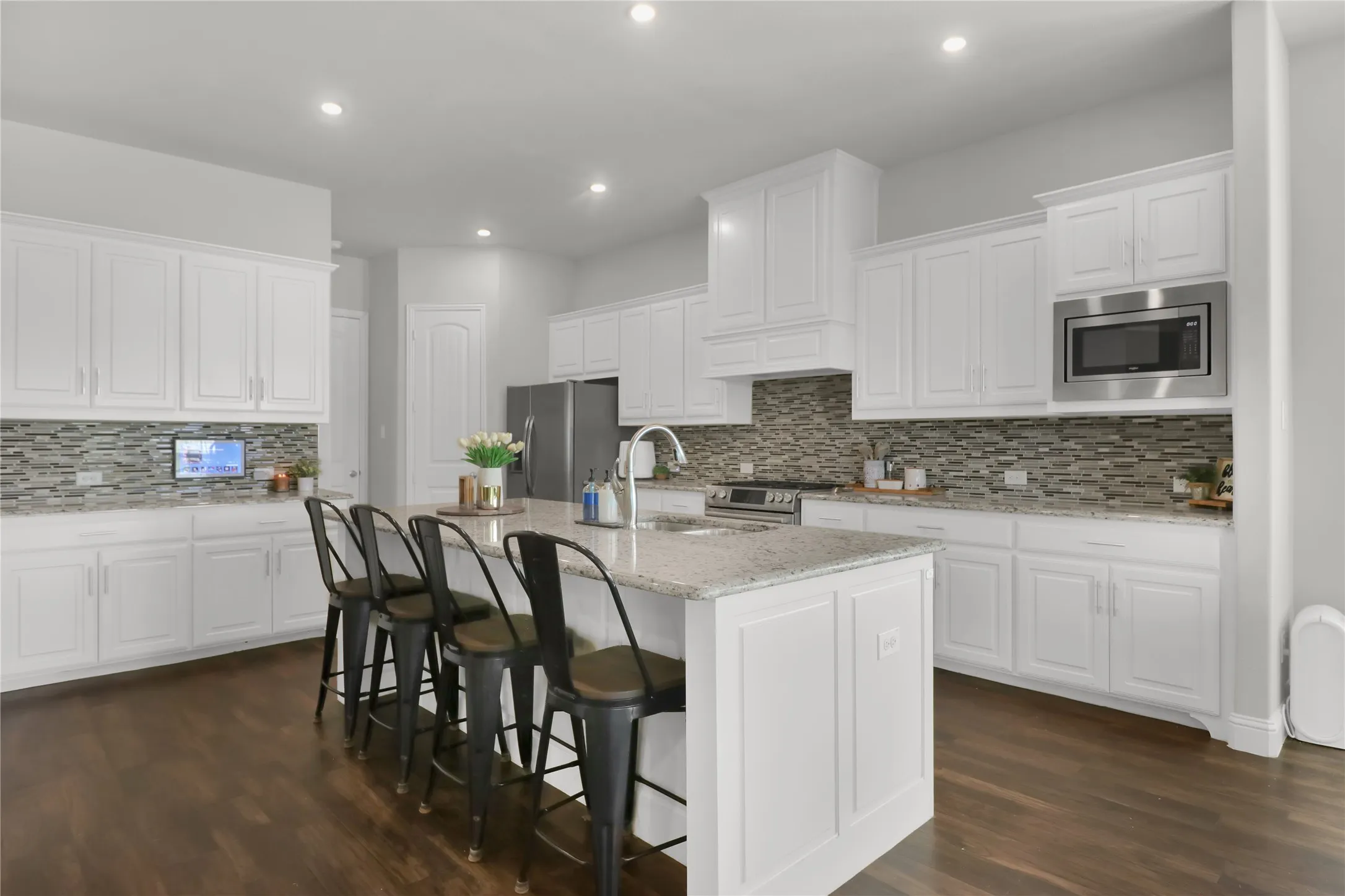 Kitchen with plenty of cabinet space and an abundance of counter space.