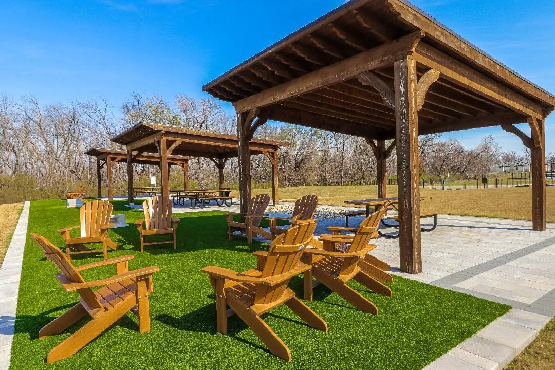 Picnic and relaxing area by the lake and courts.