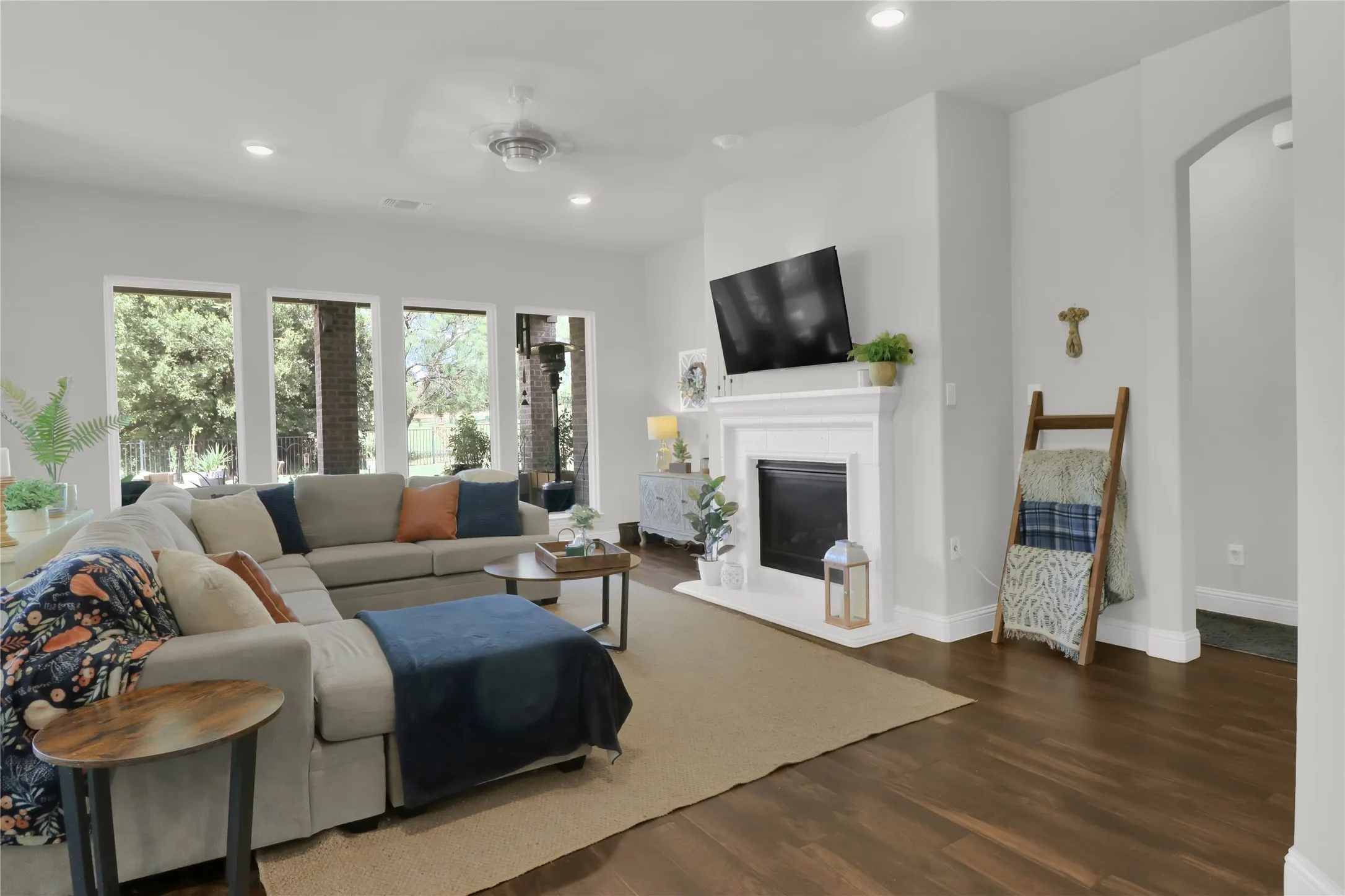 Living room with fireplace and view of the back yard.