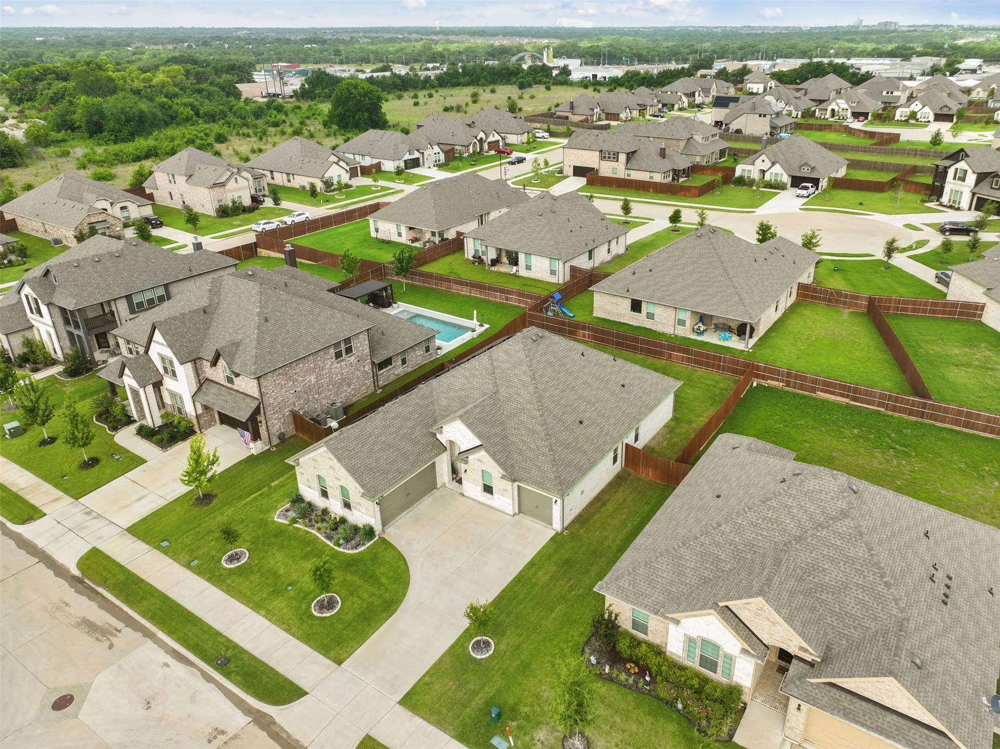 Aerial view showcasing a residential neighborhood with varied home styles