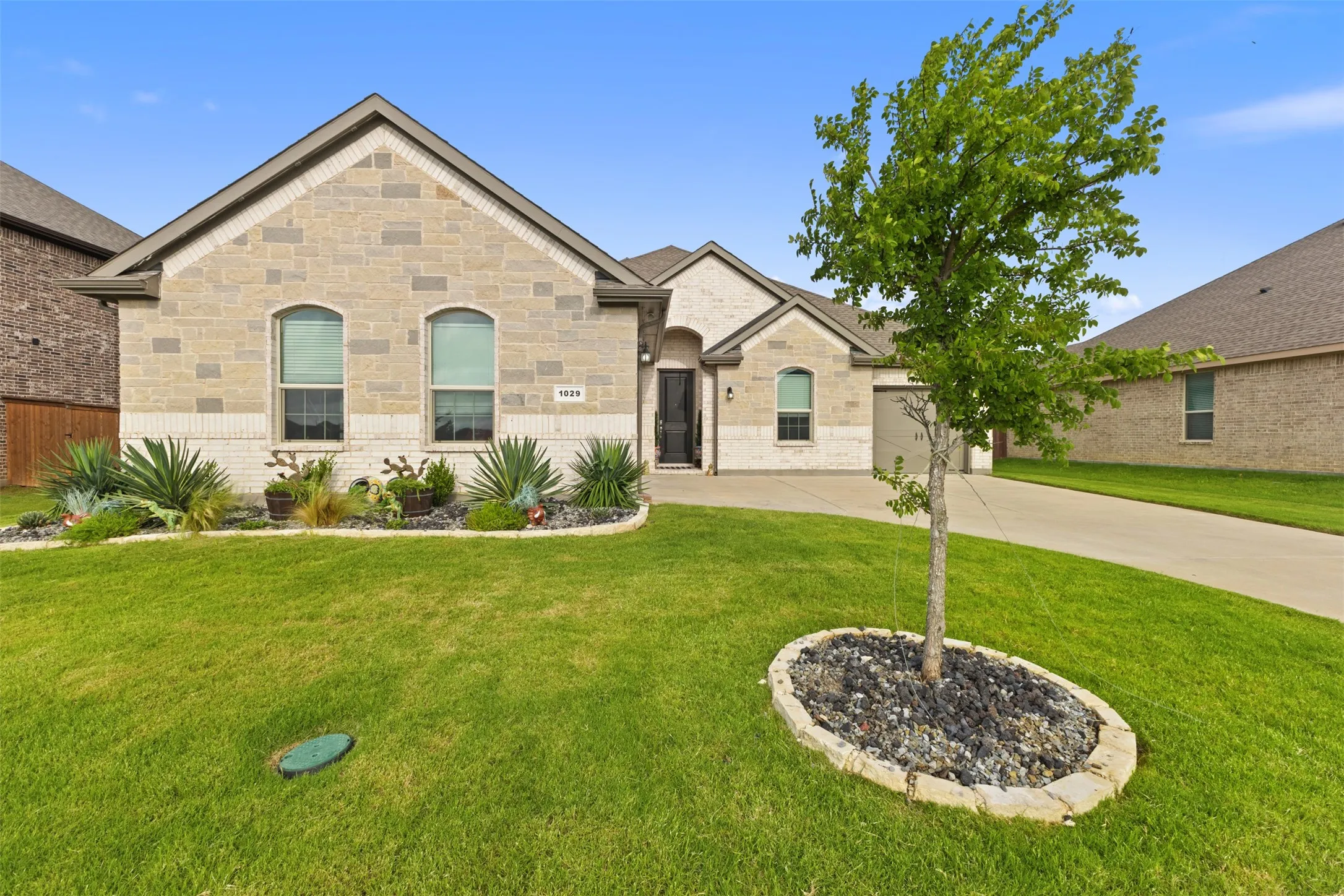 Stone and brick facade with an arched window design