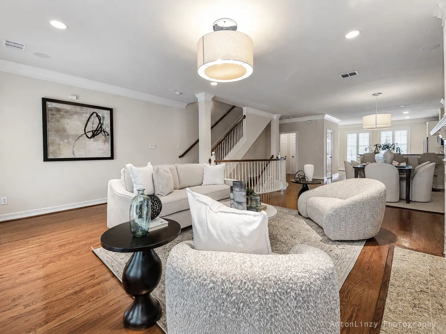 Open concept living area connects seamlessly with dining and kitchen areas