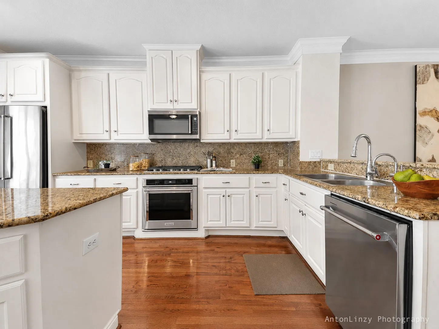 Kitchen with gas cooktop, oven, and dishwasher