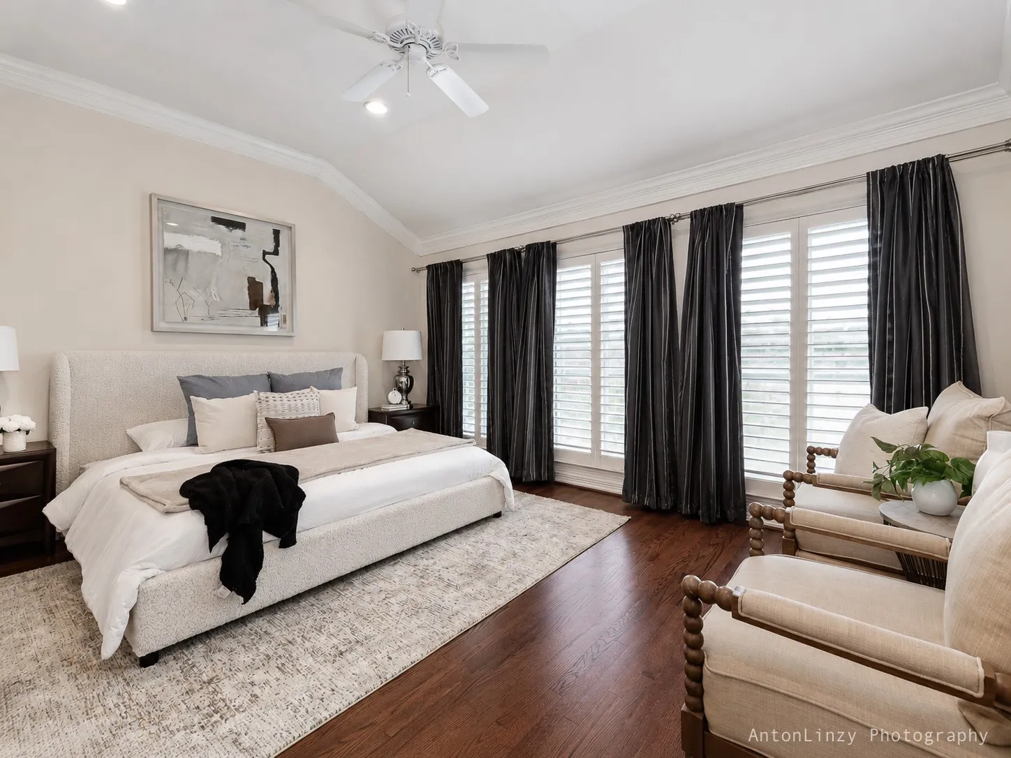 Primary bedroom features vaulted ceiling