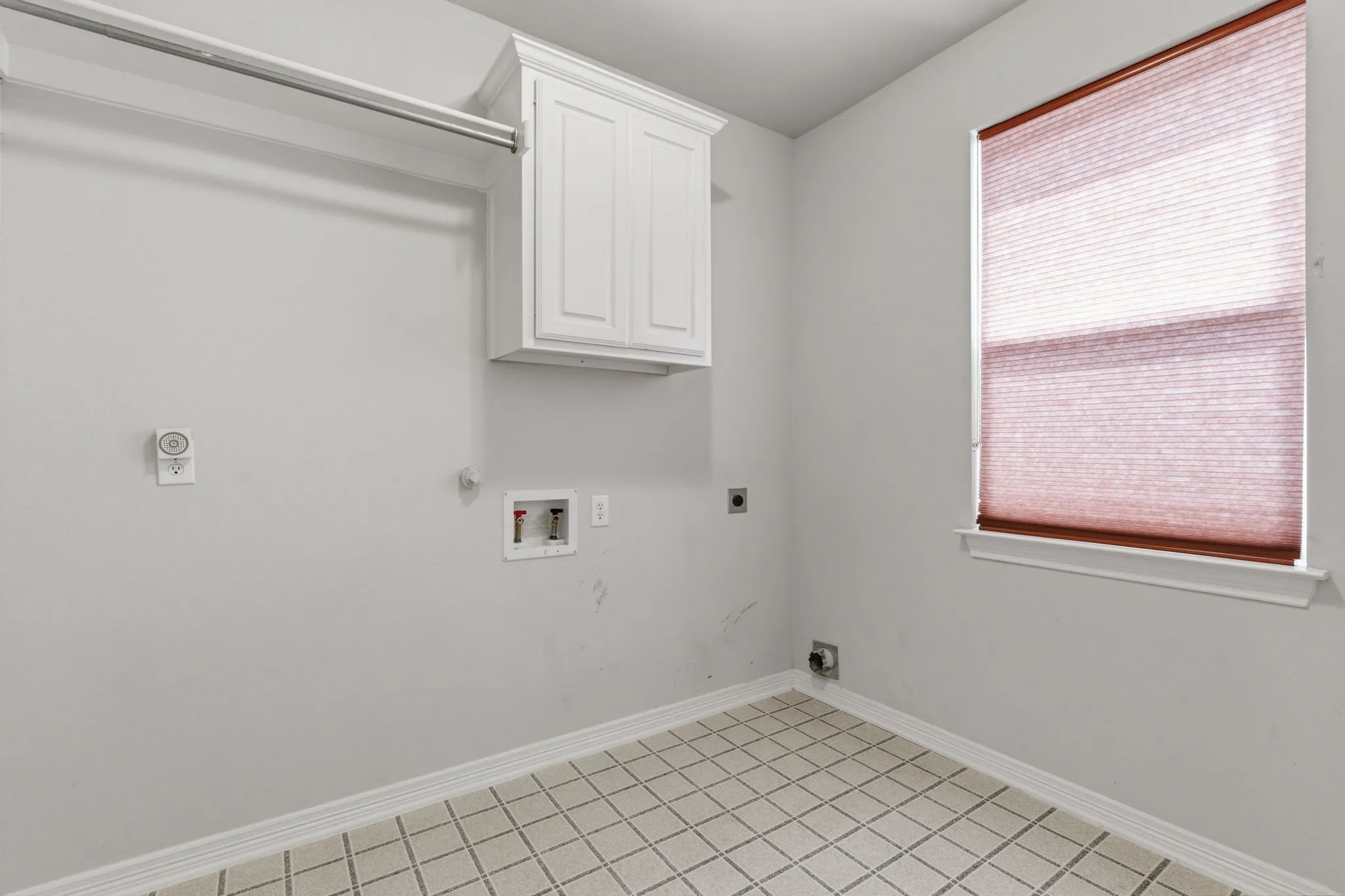 Downstairs laundry room and closet.
