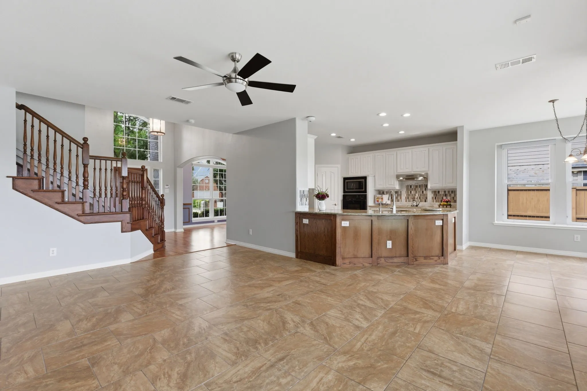Spacious and easy care 18"tile with versatile seating options with views of the lake or cozy focus on the warm gas fireplace.