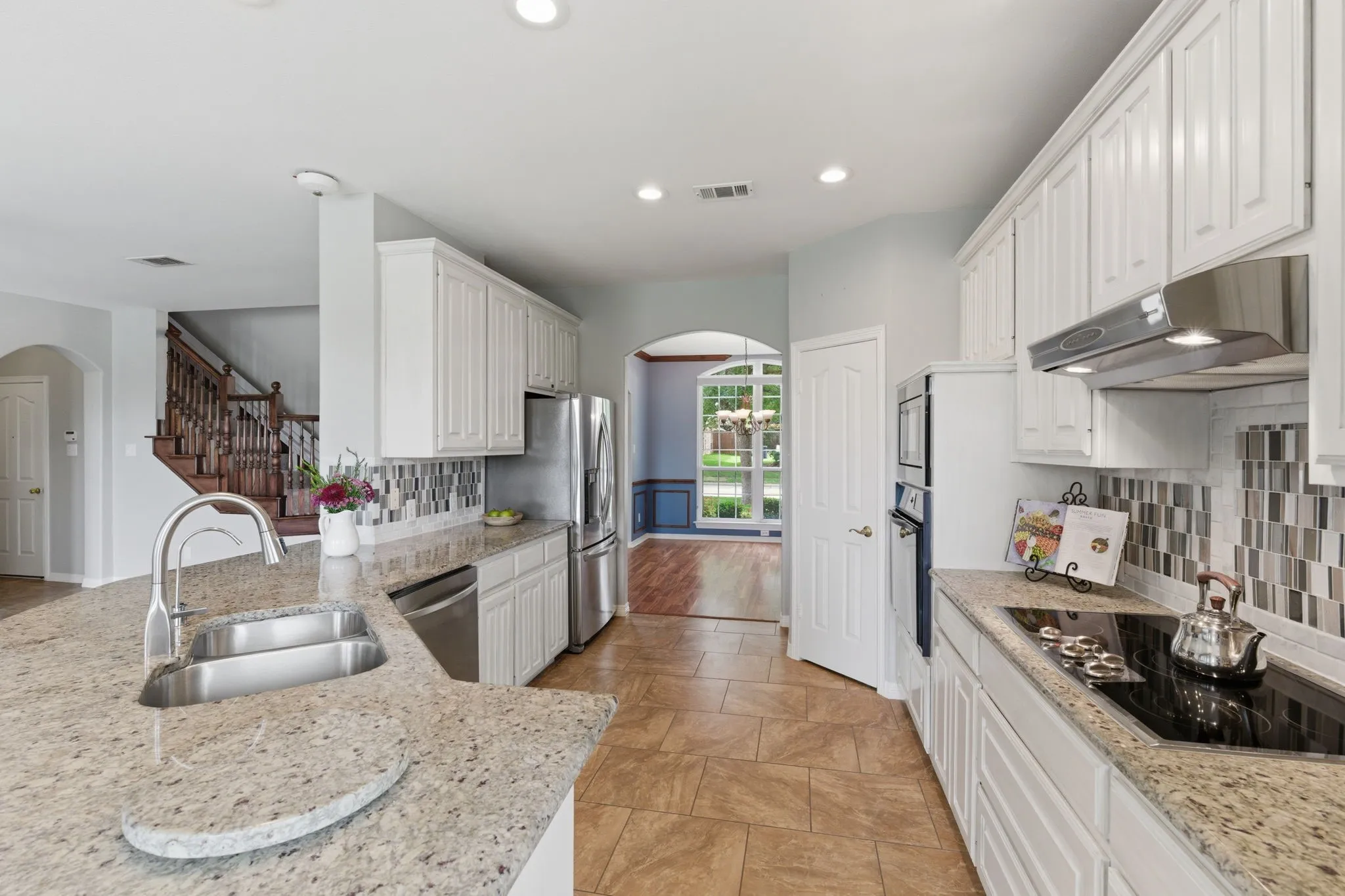 Updated cabinets and granite highlight this magnificent workfloor.