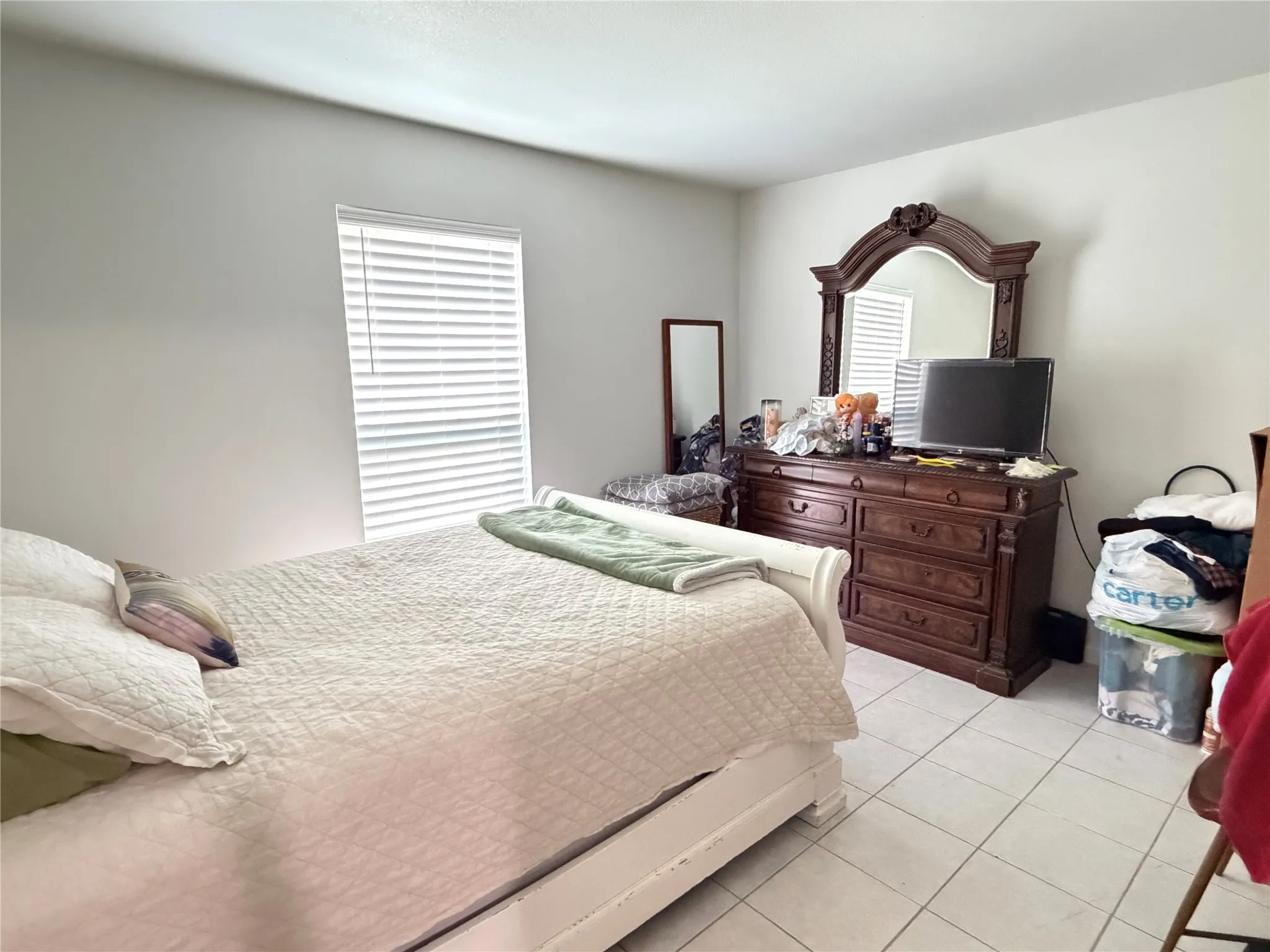 Room featuring neutral wall tones and tile flooring