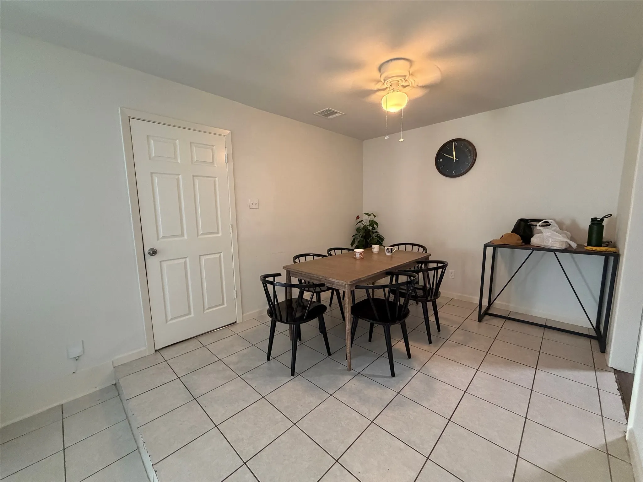 Interior space featuring light-toned tile flooring throughout