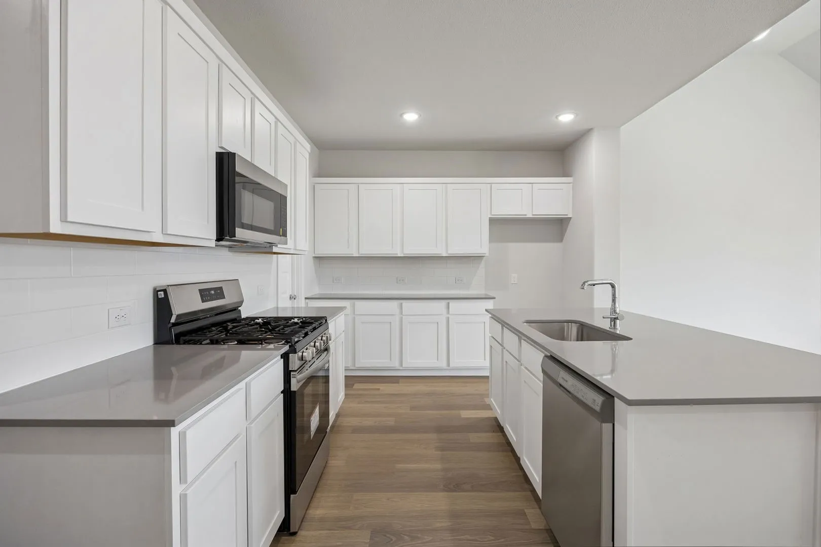 Kitchen in the Masters home plan by Trophy Signature Homes – REPRESENTATIVE PHOTO