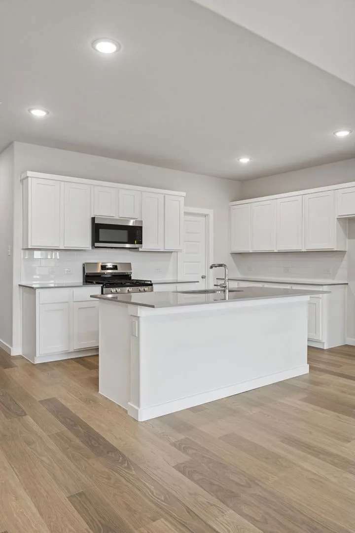 Kitchen in the Masters home plan by Trophy Signature Homes – REPRESENTATIVE PHOTO