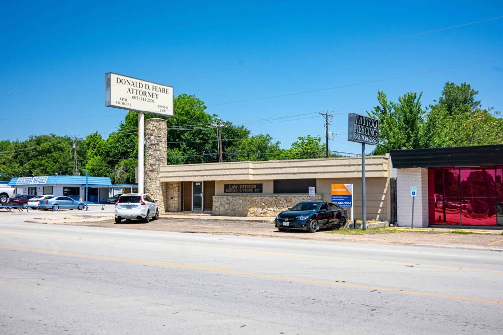 Single story building with parking in front, side and back