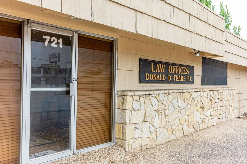 Front of building with parking