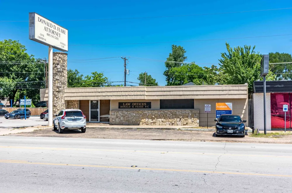 Single story building with parking in front, side and back