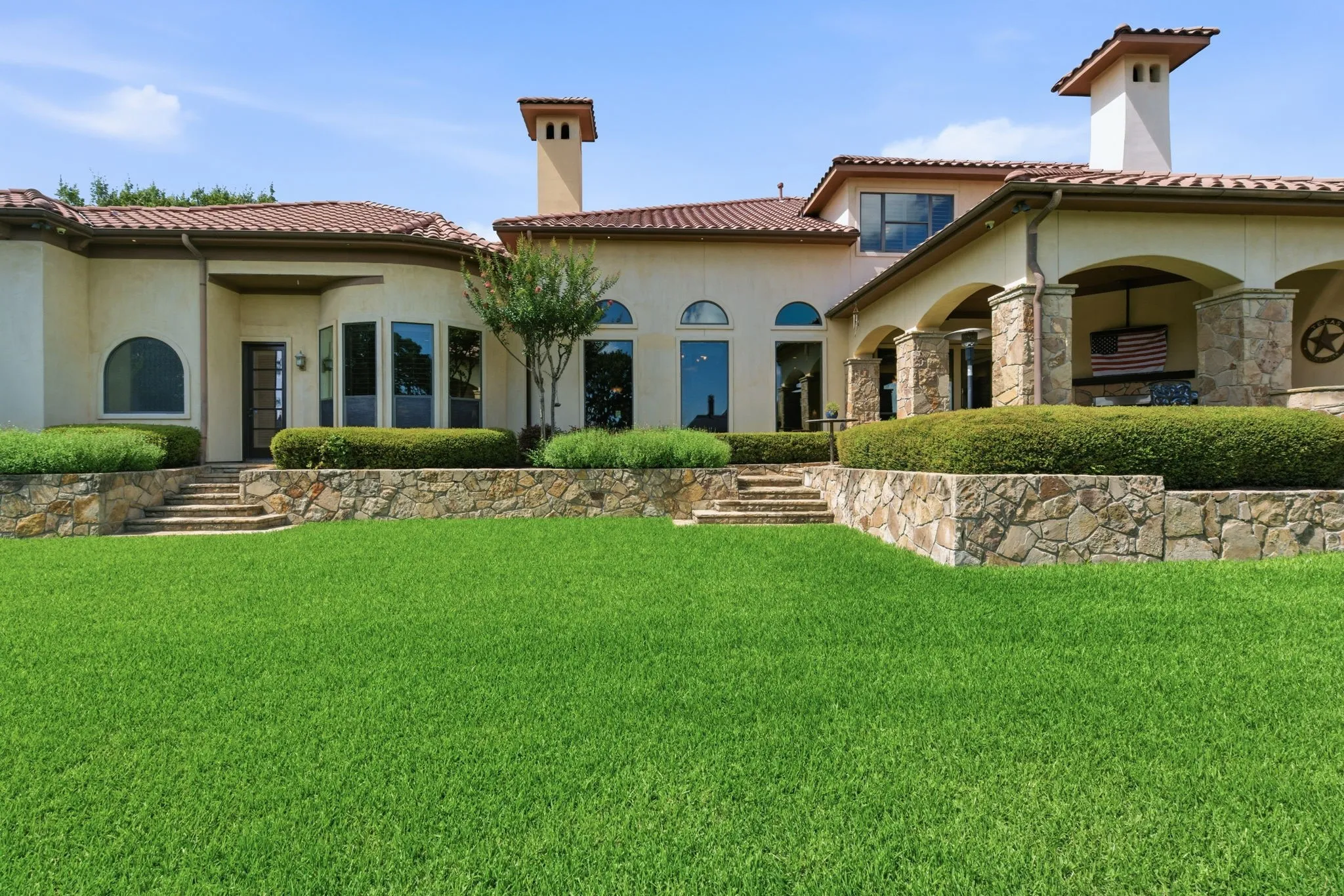 Terraced backyard with expansive​​‌​​​​‌​​‌‌​‌‌​​​‌‌​‌​‌​‌​​​‌​​ lawn