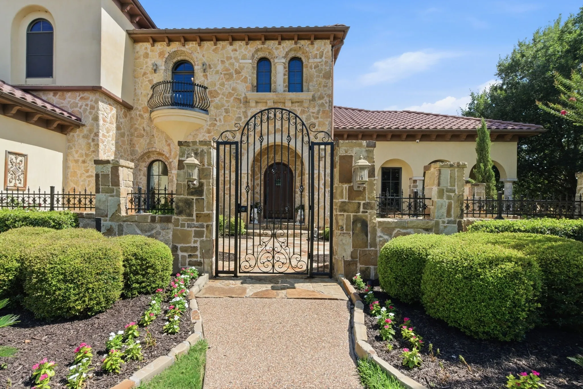 Beautiful iron gate leading to front courtyard.